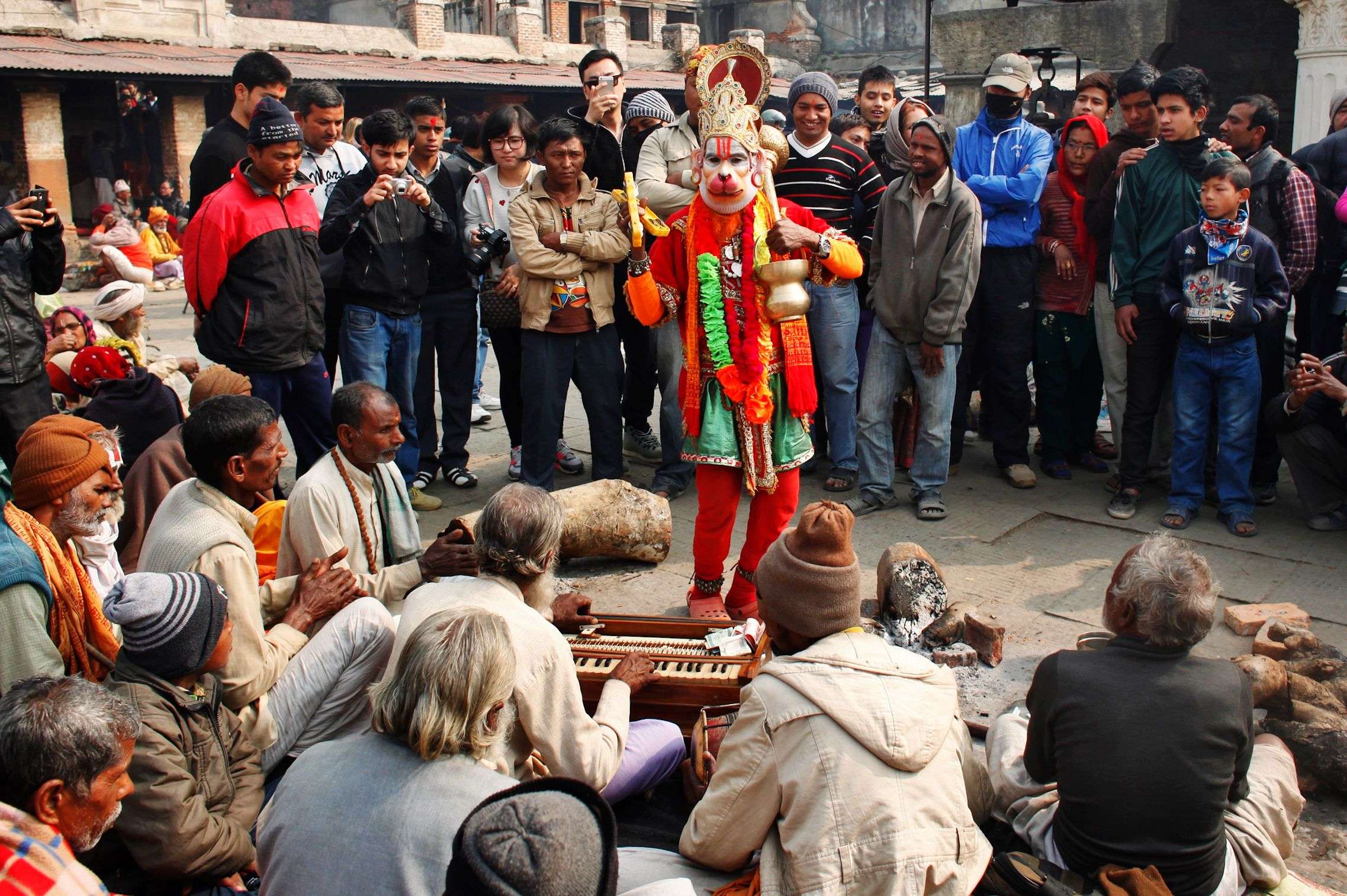 A holy man dressed as Hindu god Hanuman, dances as devotees chant religious hymns in the courtyard of the Pashupatinath temple during Shivaratri festival in Kathmandu. (AP Photo/Niranjan Shrestha)