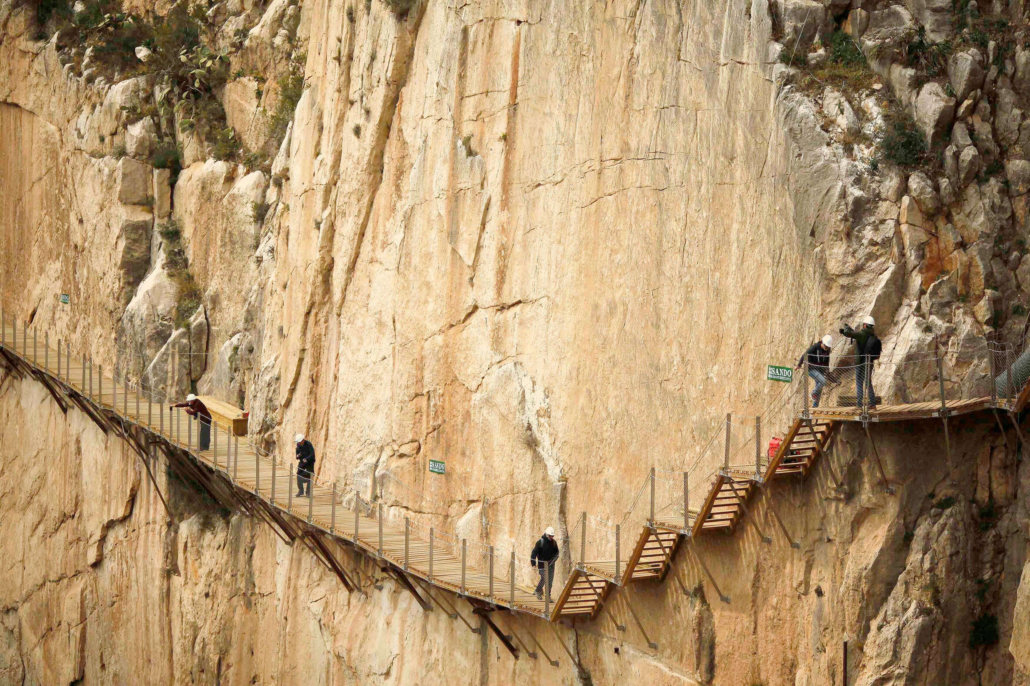 Journalists walk along the new Caminito del Rey (The King's little pathway) in El Chorro-Alora