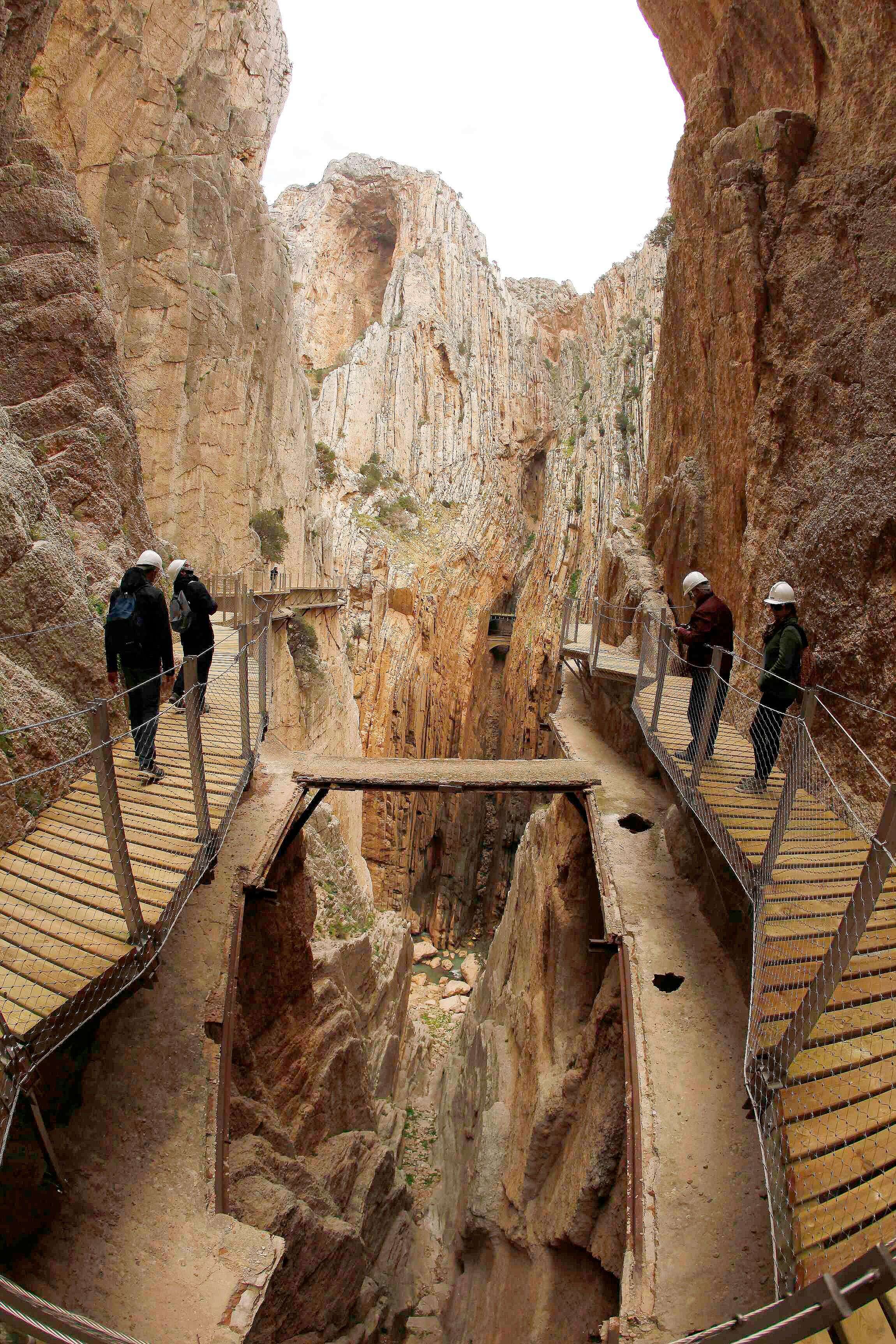 Journalists walk along the new Caminito del Rey (The King's little pathway) in El Chorro-Alora