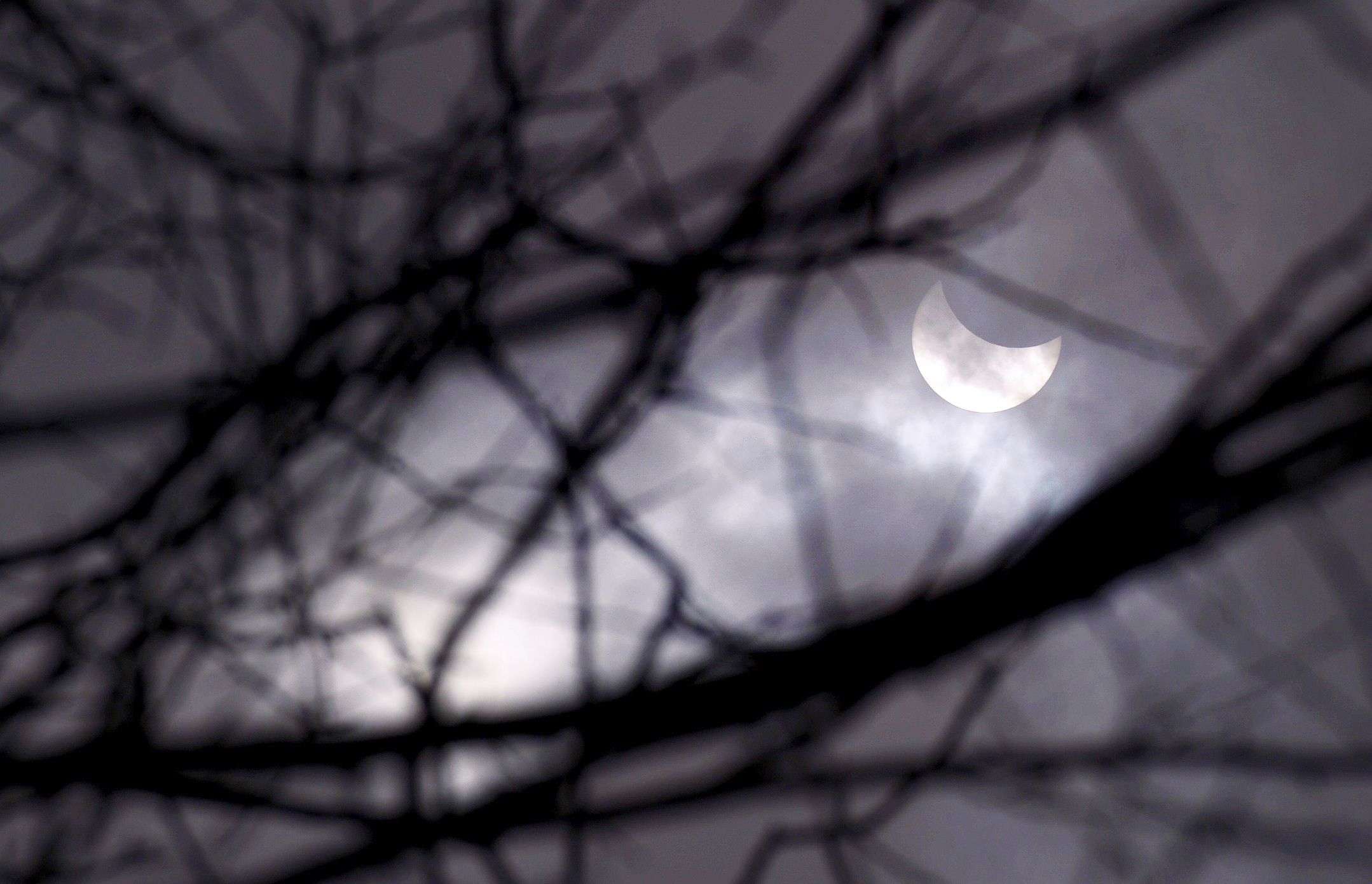 This picture shows the partial solar eclipse of the sun in the centre of Sofia. (AFP PHOTO / NIKOLAY DOYCHINOV)