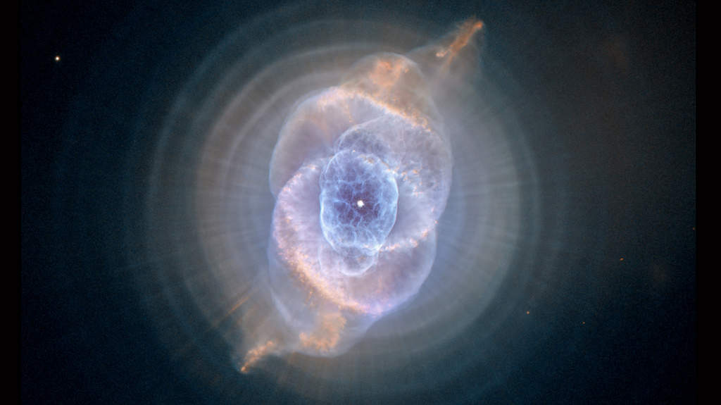 Cat’s Eye Nebula: The Cat's Eye Nebula, one of the first planetary nebulae discovered, also has one of the most complex forms known to this kind of nebula. Eleven rings, or shells, of gas make up the Cat's Eye. Each "ring" is actually the edge of a spherical bubble seen projected onto the sky — that's why it appears bright along its outer edge. The view from Hubble is like seeing an onion cut in half, where each skin layer is discernible. (Courtesy: http://hubblesite.org/)