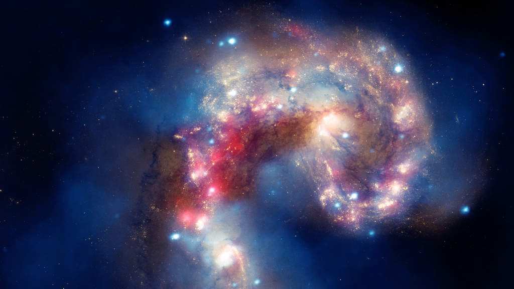 The Antennae: The colliding Antennae galaxies, located about 62 million light-years from Earth, are shown in this composite image by Hubble, the Chandra X-ray Observatory, and the Spitzer Space Telescope. The collision, which began more than 100 million years ago and is still occurring, has triggered the formation of millions of stars in clouds of dust and gas in the galaxies. (Courtesy: http://hubblesite.org/)