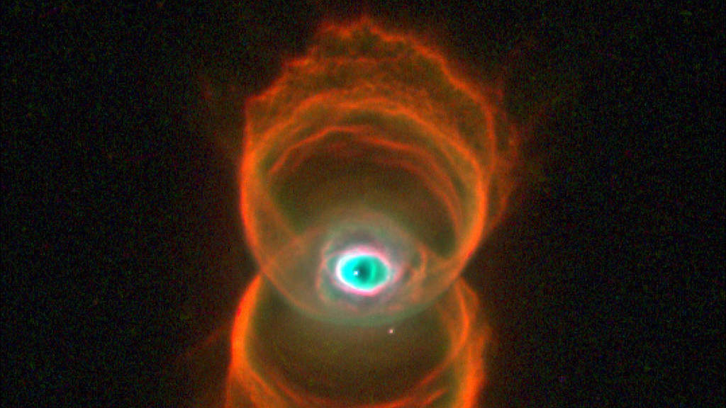 Hourglass Nebula: This snapshot of MyCn18, a young planetary nebula, reveals that the object has an hourglass shape with an intricate pattern of "etchings" in its walls. The results shed new light on the poorly understood ejection of stellar matter that accompanies the slow death of Sun-like stars. The hourglass shape may be produced by the expansion of a fast stellar wind within a slowly expanding cloud, which is denser near its equator than near its poles. (Courtesy: http://hubblesite.org/)