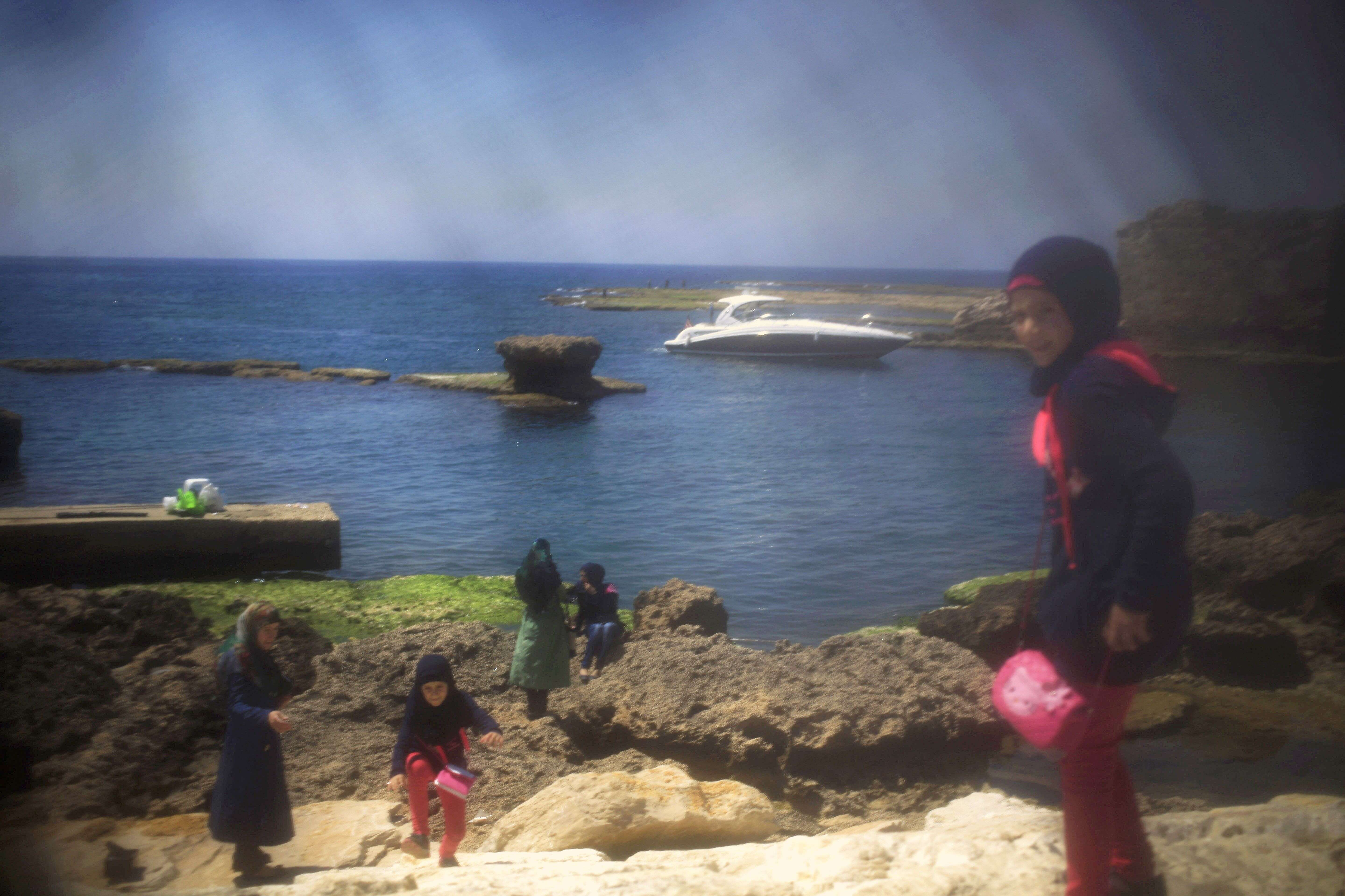 A family enjoys the ancient port city of Byblos north of Beirut, Lebanon. 