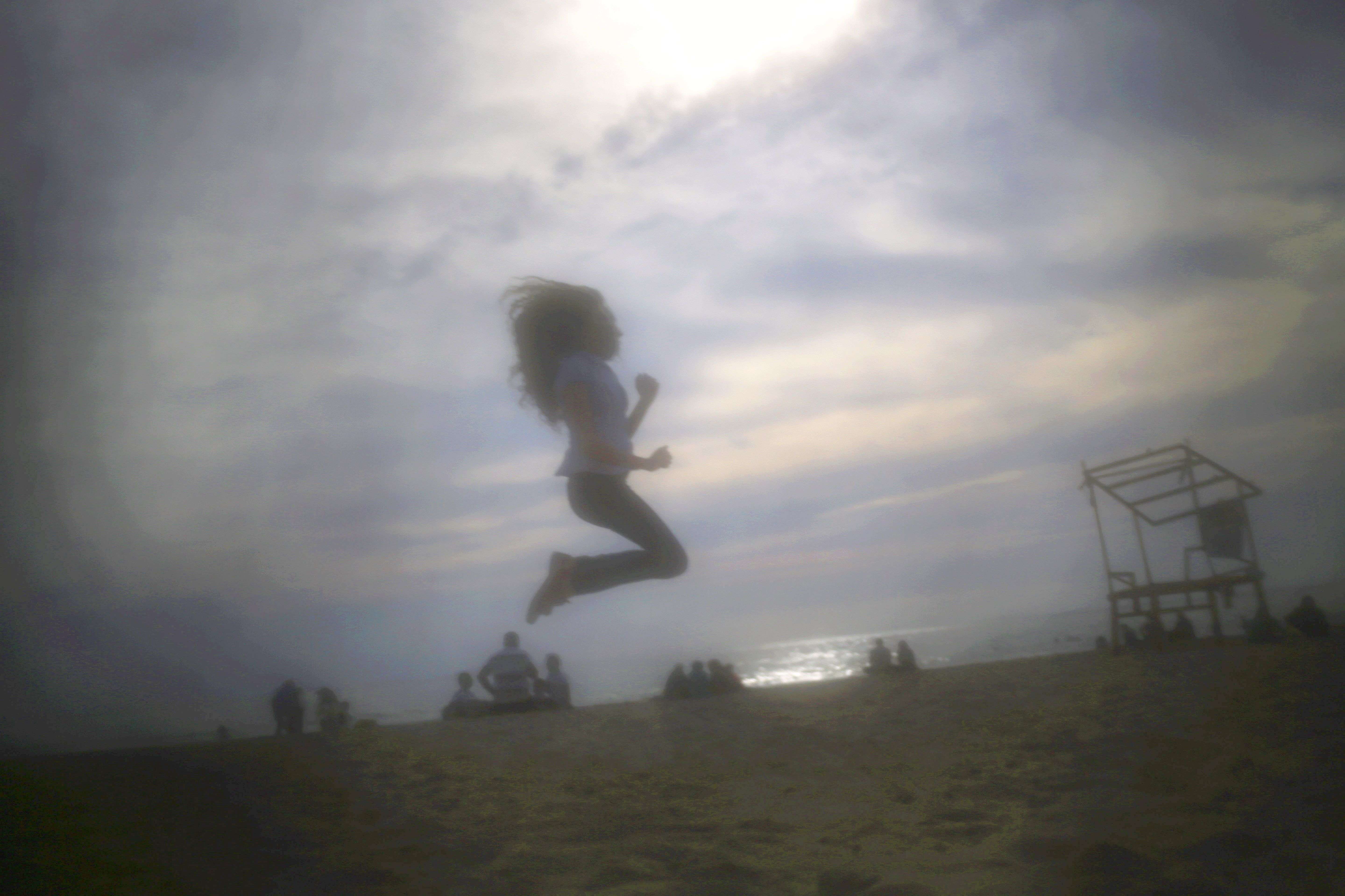 A girl jumps at the public beach of Ramlet al Bayda in Beirut, Lebanon. 