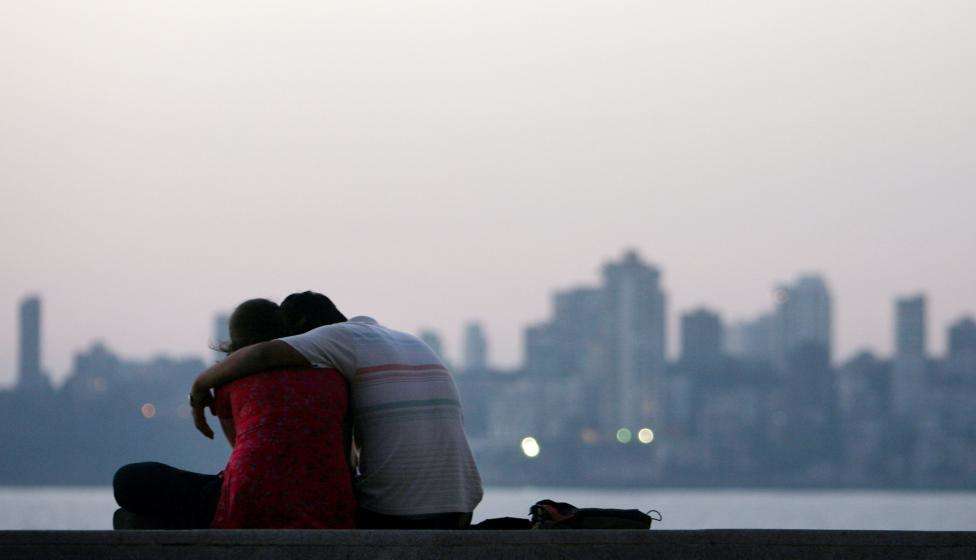 A couple sits on the seafront on the eve of Valentine's Day in Mumbai. (REUTERS/Arko Datta/Files)