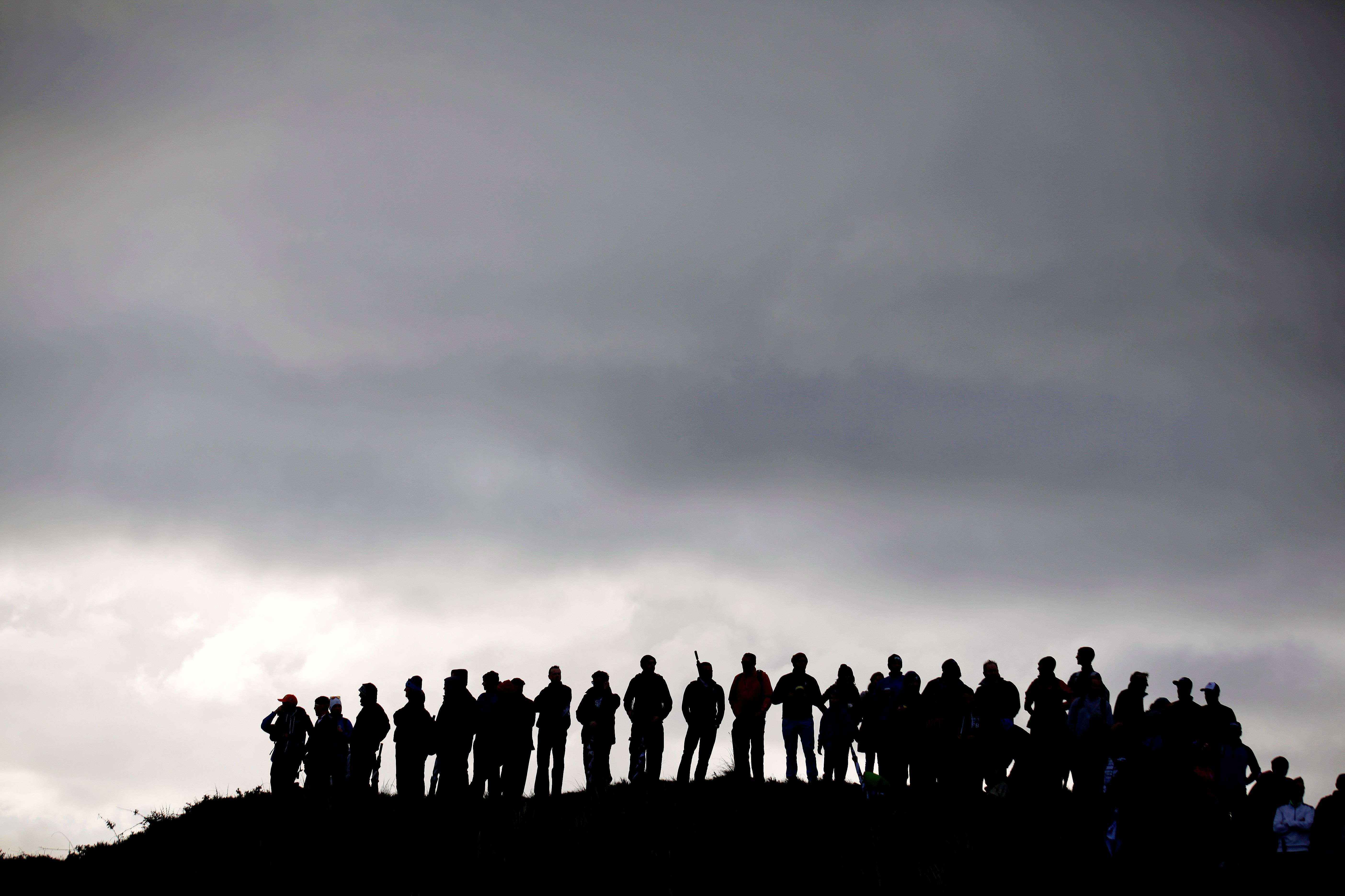 Golf fans wait for Northern Ireland’s Rory McIlroy during round one of the Irish Open Golf Championship at Royal County Down, Newcastle, Northern Ireland.(AP/Peter Morrison) 