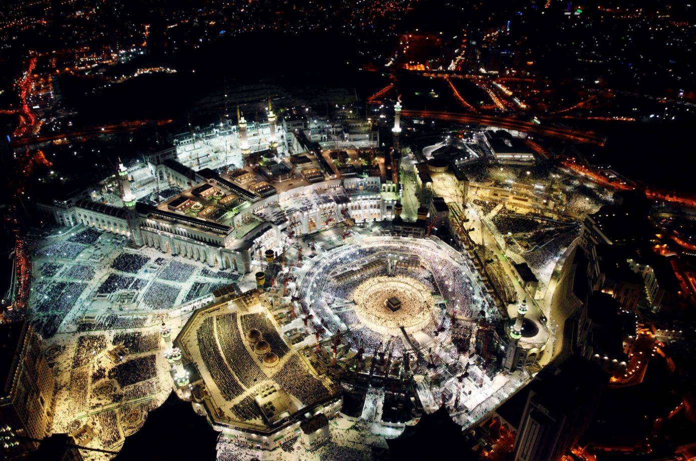 A picture taken from the Abraj al-Bait Towers, also known as the Mecca Royal Hotel Clock Tower, shows Muslim worshipers praying at the Grand Mosque in the Muslim holy city of Mecca, a day before the end of the fasting month of Ramadan. The Grand Mosque, which contains Islam's holiest site the Kaaba, can now hold 1.85 million people. (AFP) 