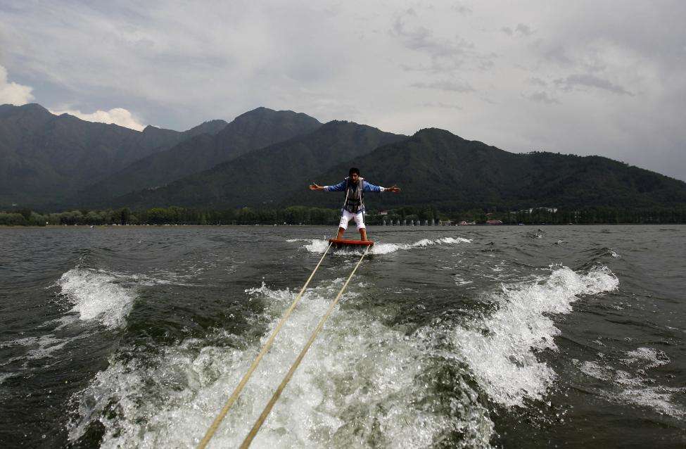A tourist enjoys water skiing on the waters of Dal Lake in Srinagar. (REUTERS/Fayaz Kabli/Files)