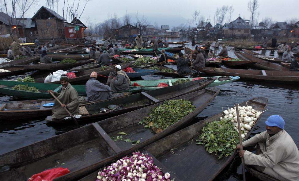 Kashmiri vegetable vendors assemble at a floating market in the interiors of the Dal Lake in Srinagar. (REUTERS/Danish Ismail/Files)