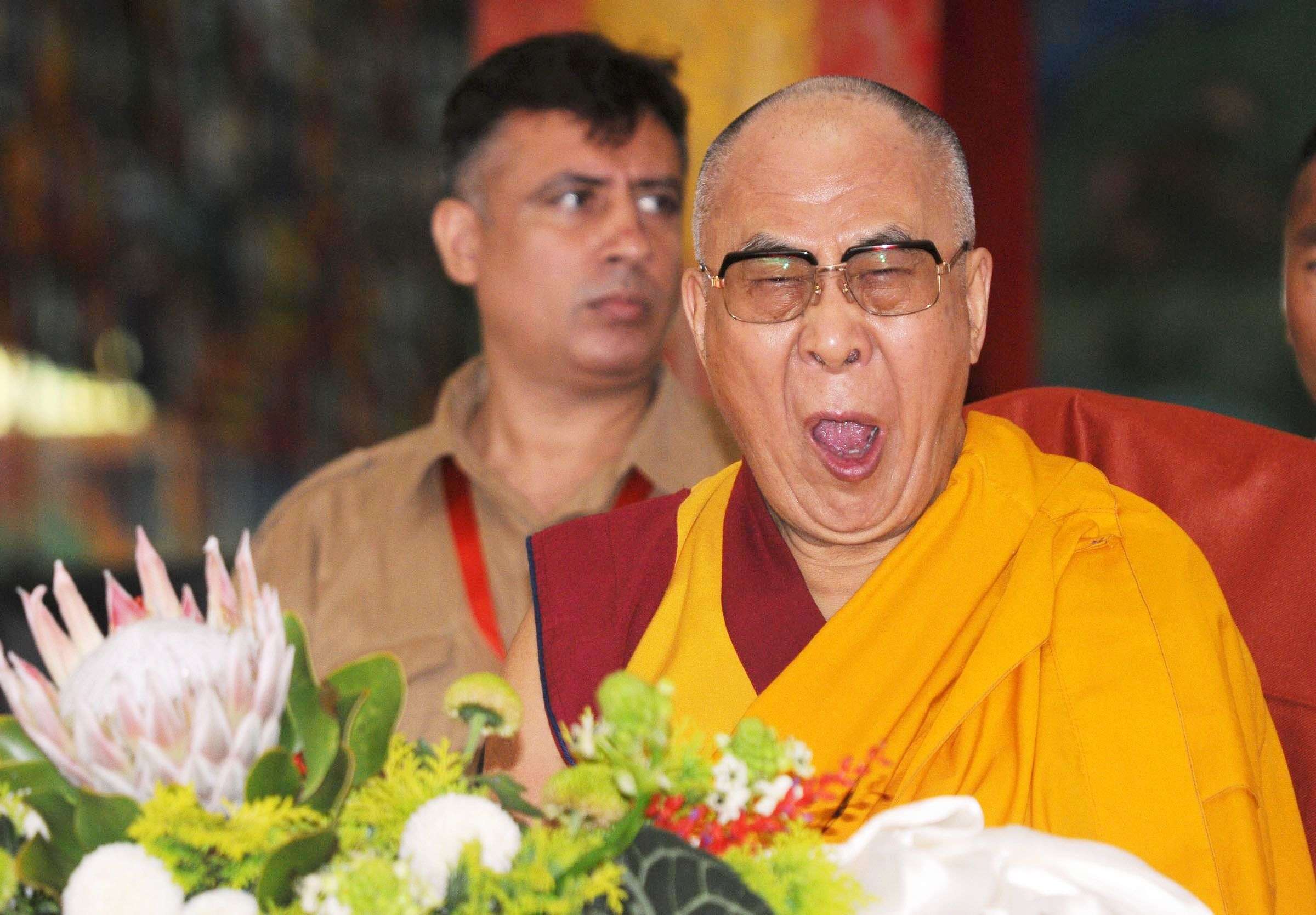 The Dalai Lama yawns during his birthday celebration at Bylakuppe near Mysore