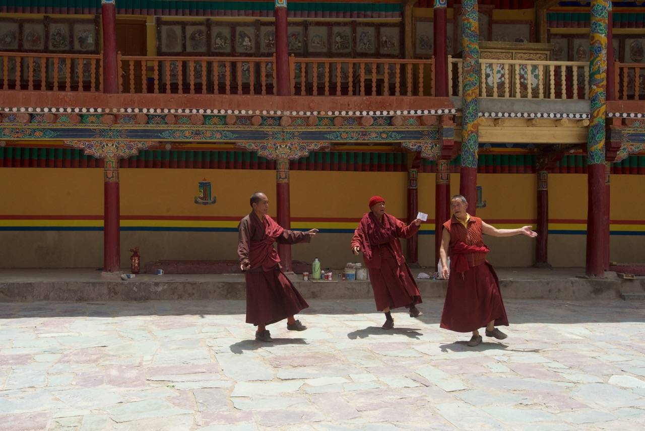 Communion: Monks praying and dancing at the Hemis Monastery 