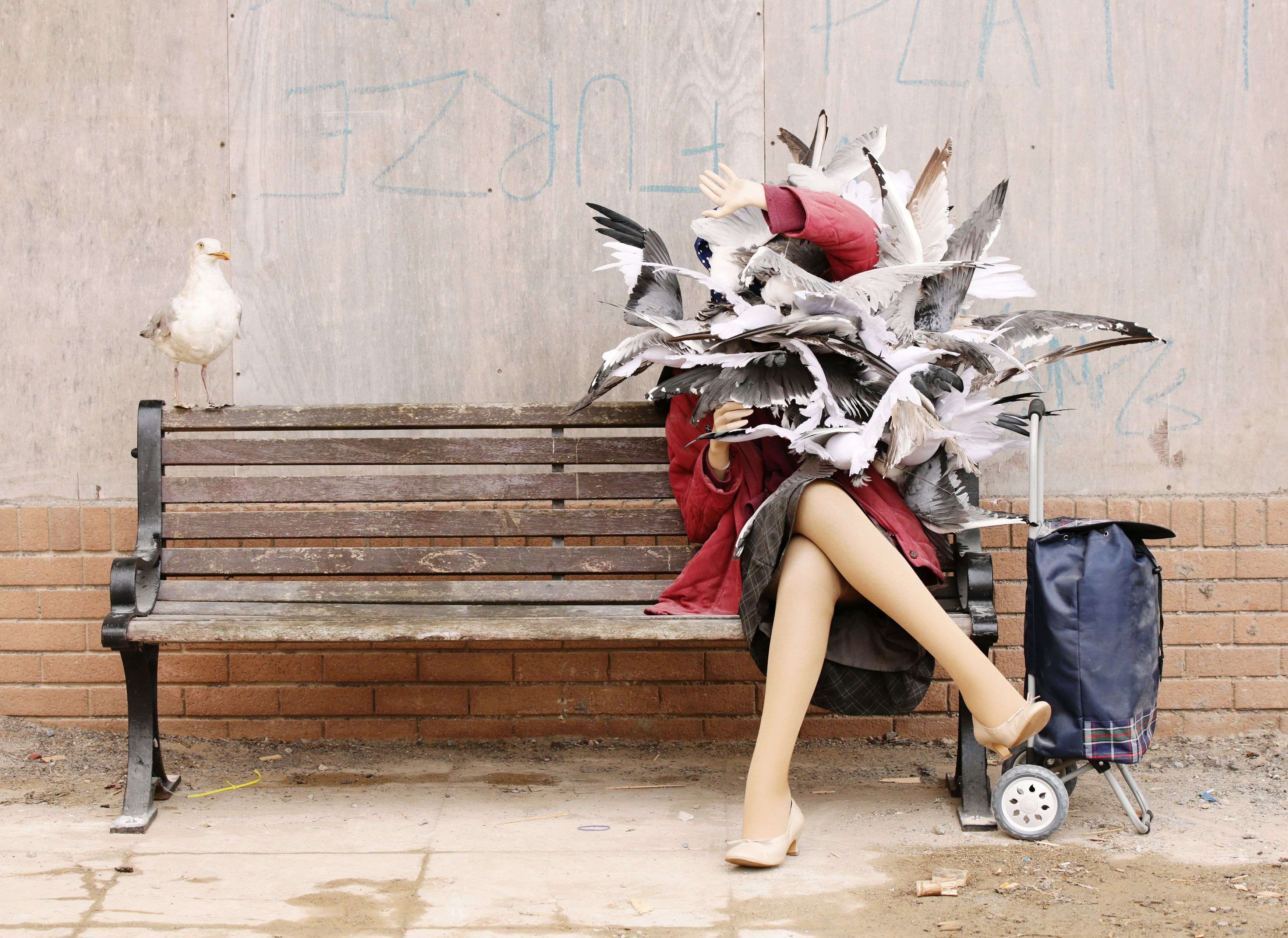 A Banksy piece depicting a woman attacked by seagulls is displayed at Banksy's biggest show to date, entitled 'Dismaland', during a press viewing in Western-super-Mare, Somerset, England, Thursday, Aug. 20, 2015. (Yui Mok/PA Wire via AP) UNITED KINGDOM OUT, NO SALES, NO ARCHIVE