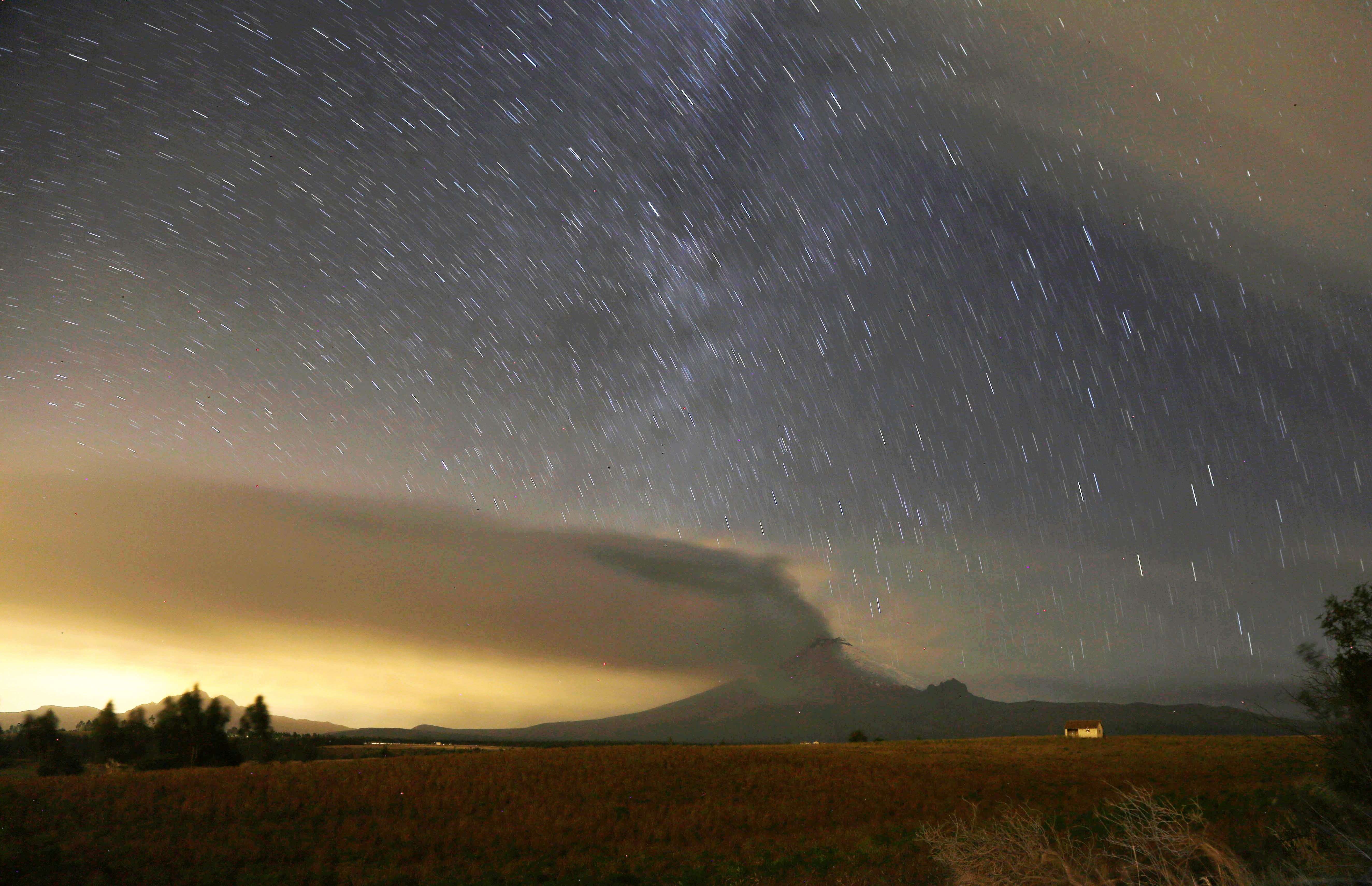 In this time exposure photo, the Cotopaxi volcano spews ash and vapor, as seen from Alaquez, Ecuador, Thursday, Sept. 3, 2015. Cotopaxi began showing renewed activity in April and its last major eruption was in 1877. (AP Photo/Dolores Ochoa)