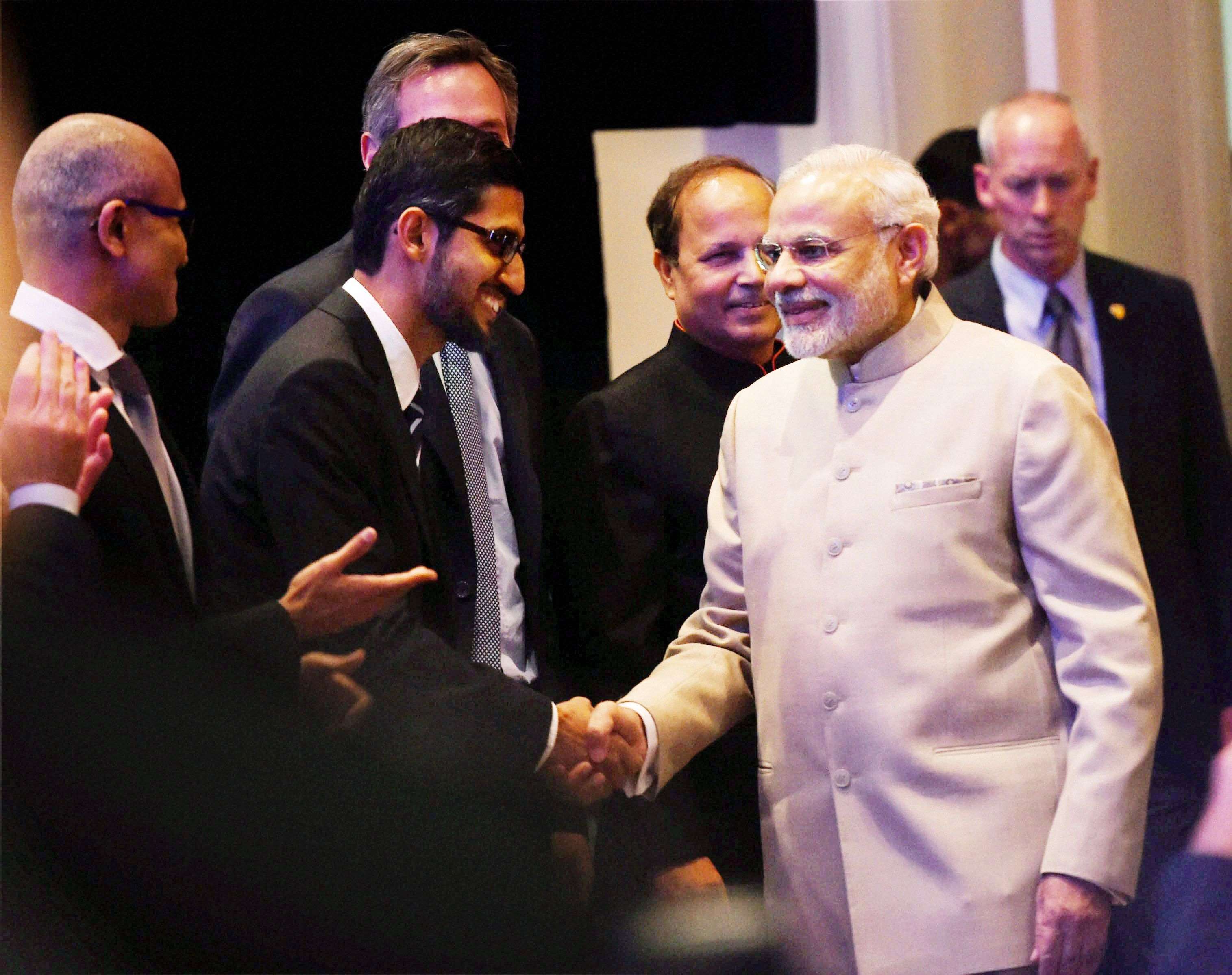 San Jose: Prime Minister Narendra Modi shakes hands with Google CEO Sundar Pichai  during the Digital India and Digital Technology dinner function in San Jose on Saturday. PTI Photo by Subhav Shukla   (PTI9_27_2015_000122B)