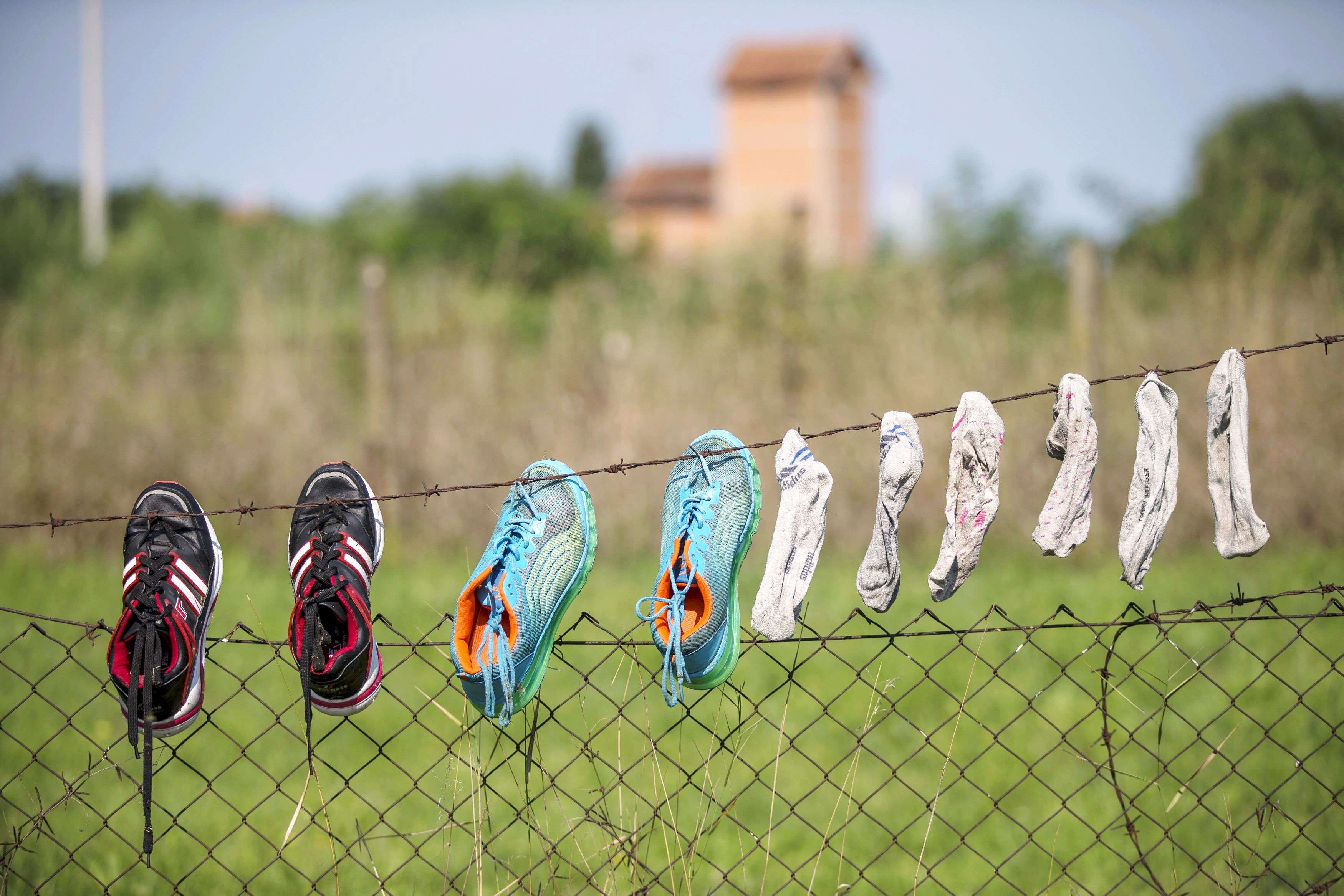 Shoes and socks belonging to Syrian migrants are hung to dry near the Serbian border with Hungary, near the village of Horgos. (REUTERS/Marko Djurica)