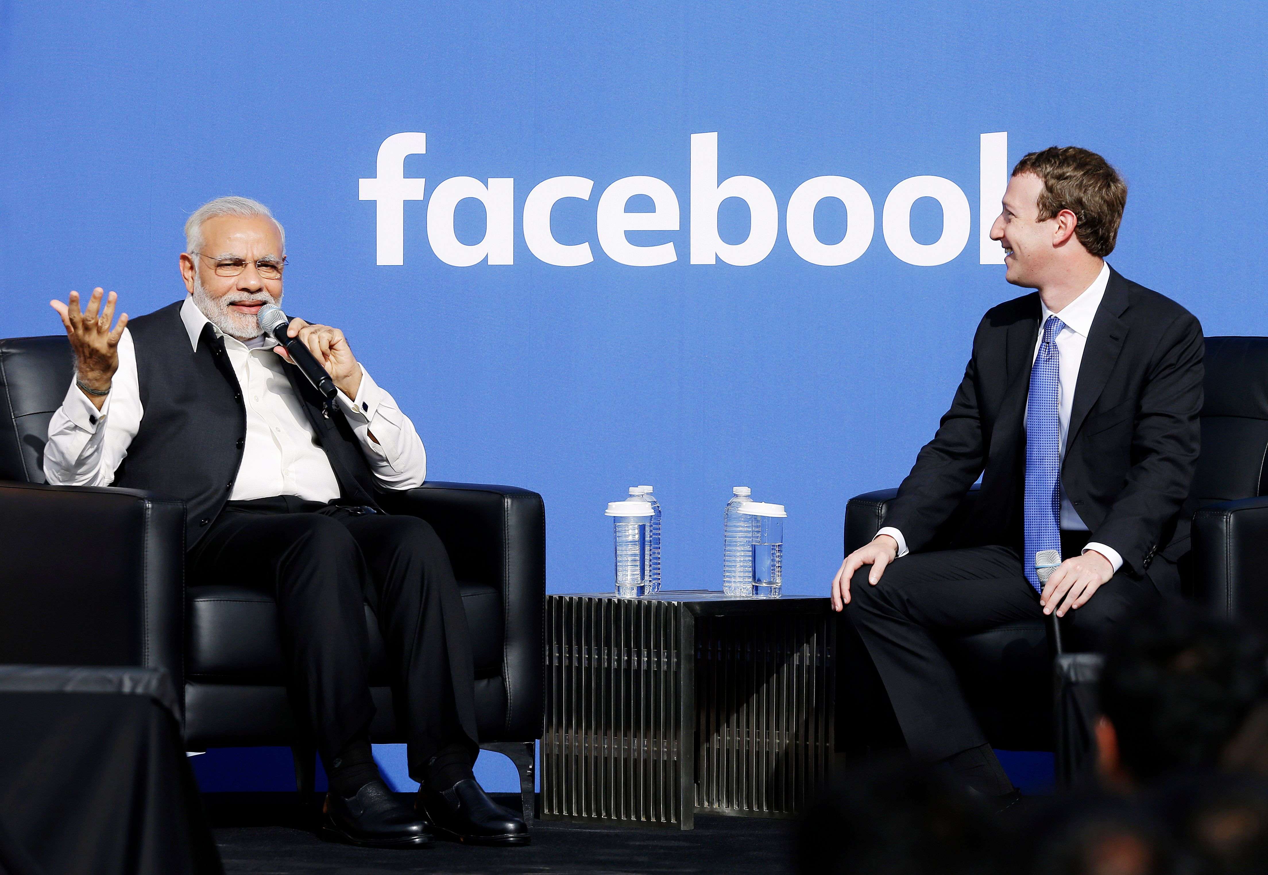 Prime Minister of India Narendra Modi, left, speaks next to Facebook CEO Mark Zuckerberg at Facebook in Menlo Park, Calif., Sunday, Sept. 27, 2015.  A rare visit by Indian Prime Minister Narendra Modi this weekend has captivated his extensive fan club in the area and commanded the attention of major U.S. technology companies eager to extend their reach into a promising overseas market. (AP Photo/Jeff Chiu)