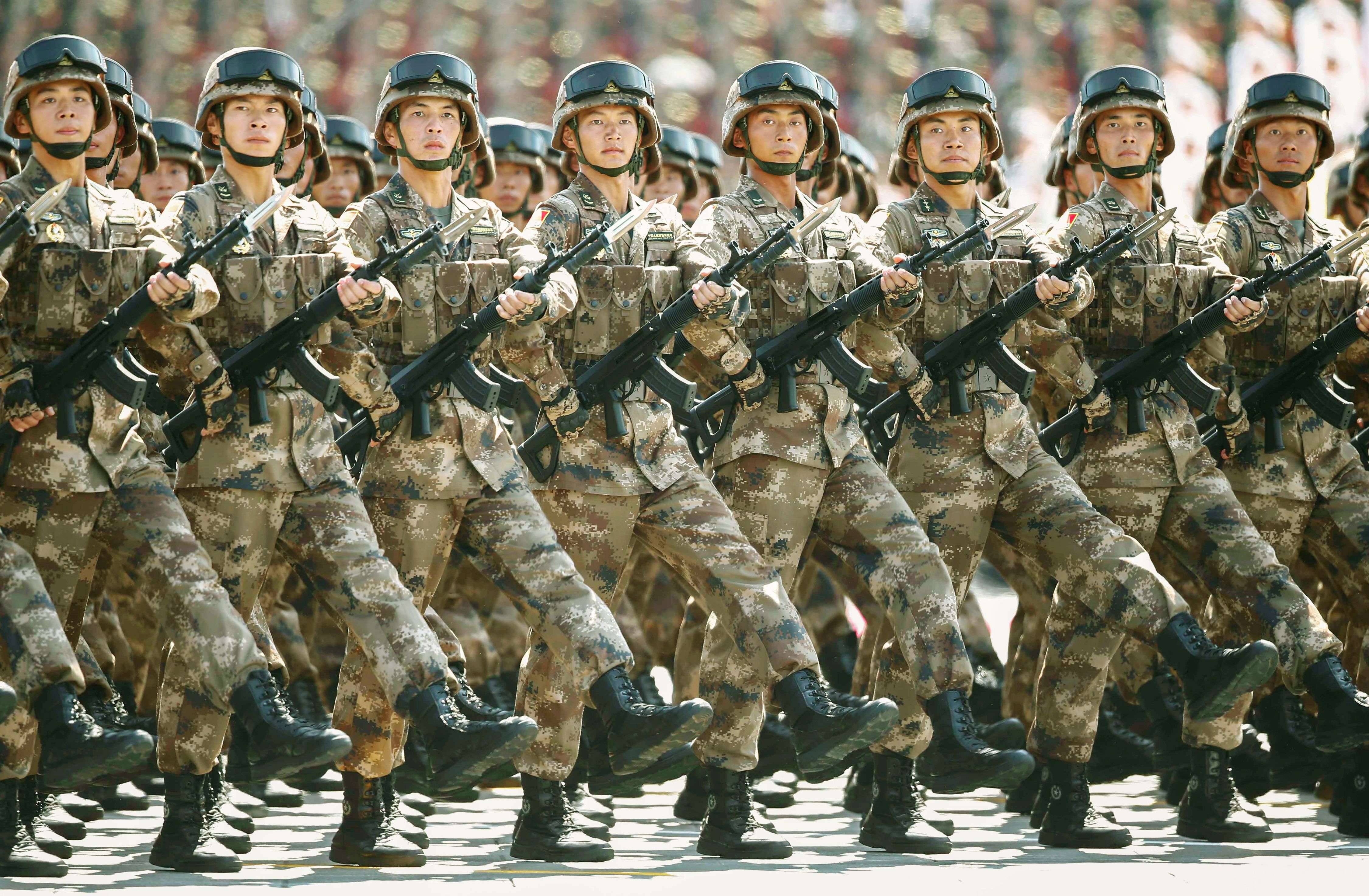 Chinese soldiers march during a parade commemorating the 70th anniversary of Japan's surrender during World War II in front of Tiananmen Gate in Beijing, Thursday, Sept. 3, 2015. The spectacle involved more than 12,000 troops, 500 pieces of military hardware and 200 aircraft of various types, representing what military officials say is the Chinese military's most cutting-edge technology. (Rolex Dela Pena/Pool Photo via AP)
