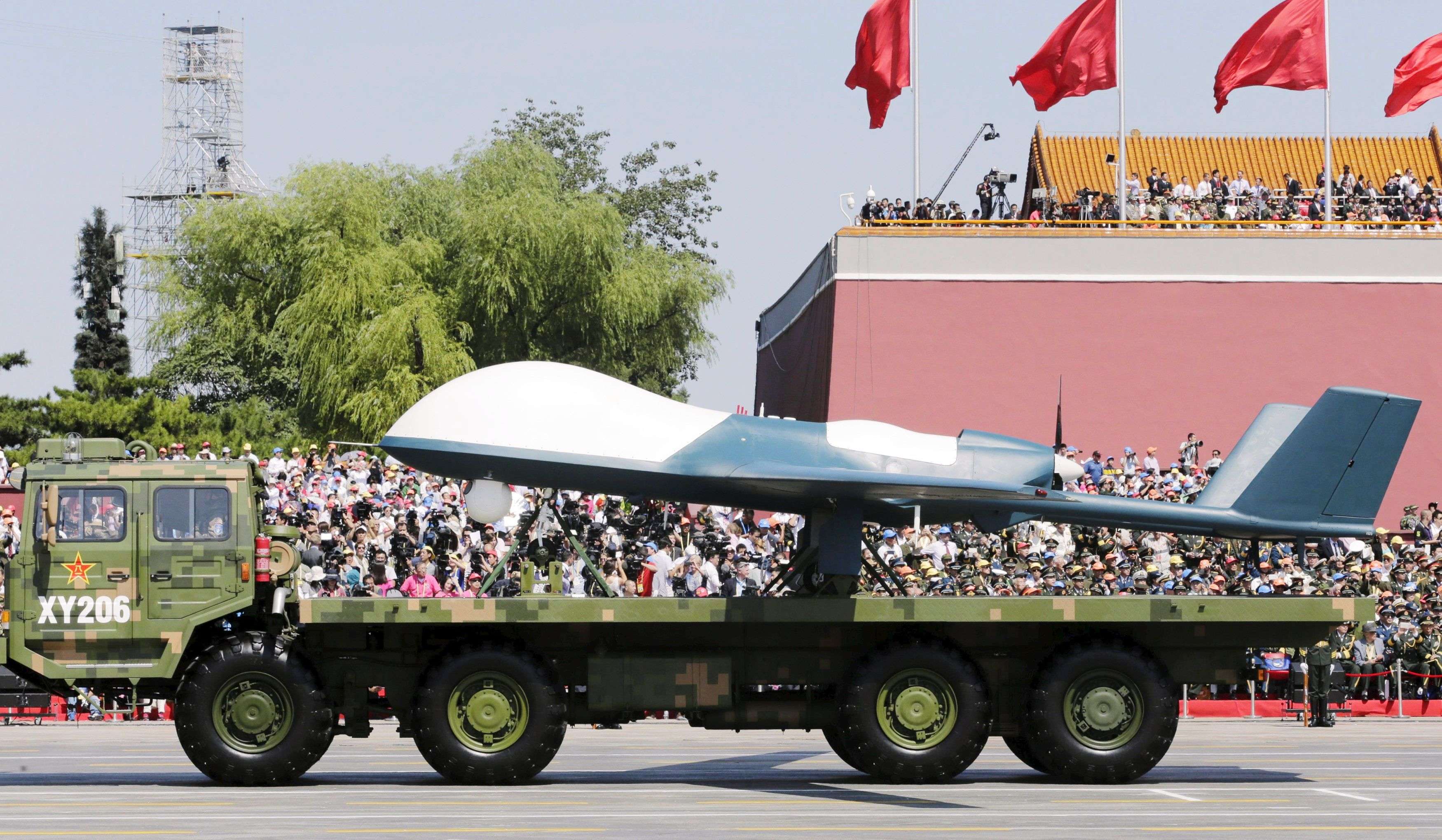 A military vehicle carrying a Pterodactyl I unmanned aerial vehicle drivess past the Tiananmen Gate during a military parade to mark the 70th anniversary of the end of World War Two, in Beijing, China, September 3, 2015. REUTERS/Jason Lee