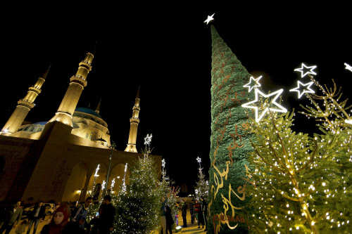A Christmas tree designed by Lebanese designer Elie Saab in front of al Amin mosque in Beirut, Lebanon (Photo Courtesy: Jamal-Saidi/ Reuters)