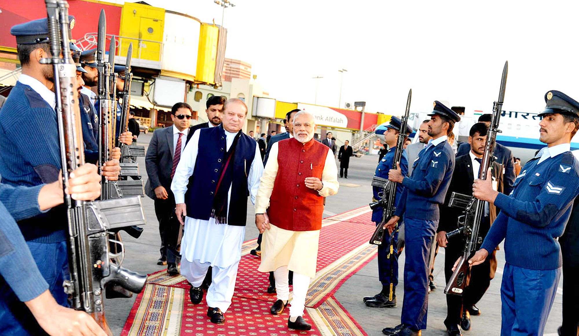 In this photo released by Press Information Department, India's Prime Minister Narendra Modi, right, reviews guard of honor with his Pakistani counterpart Nawaz Sharif in Lahore, Pakistan, Friday, Dec. 25, 2015. Modi arrived in Pakistan on Friday, his first visit as prime minister to this Islamic nation that has been India's long-standing archrival in the region. (AP Photo/Press Information Department)