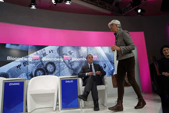 Raymond 'Ray' Dalio, billionaire and founder of Bridgewater Associates LP, left, Christine Lagarde, managing director of the International Monetary Fund (IMF), centre, and Zhang Xin, billionaire and chief executive officer of Soho China Ltd., arrive for a panel session at the World Economic Forum (WEF) in Davos, Switzerland, on Thursday, Jan. 21, 2016. World leaders, influential executives, bankers and policy makers attend the 46th annual meeting of the World Economic Forum in Davos from Jan. 20 - 23. Photographer: Matthew Lloyd/Bloomberg via Getty Images