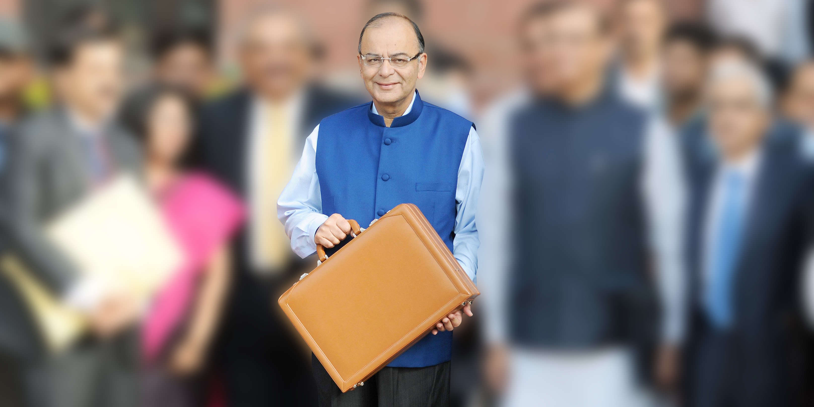 Finance Minister Arun Jaitley holds a briefcase containing union budget for the year 2015-16 as he leaves his office for Parliament to present the union budget in New Delhi. PHOTO BY ASHWANI NAGPAL