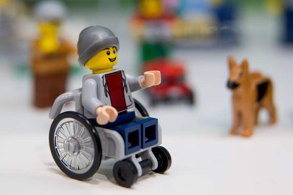A Lego figure in a wheelchair is pictured at the Lego booth on January 28, 2016 in Nuernberg during the 67th International Toy Fair.  / AFP / dpa / Daniel Karmann / Germany OUT