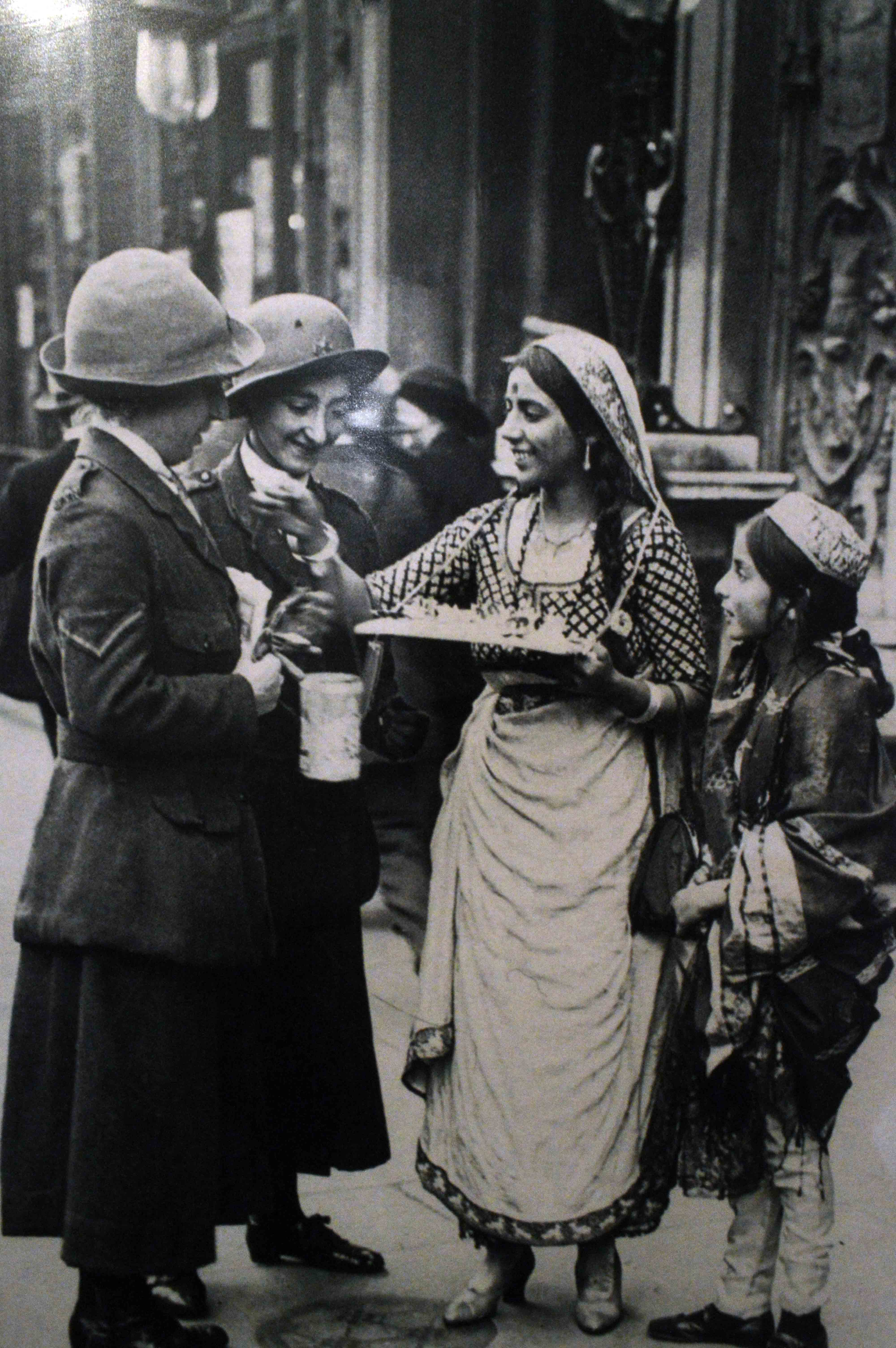 A young Indian woman and a girl raise funds in England for Indian soldiers fighting in the First World War