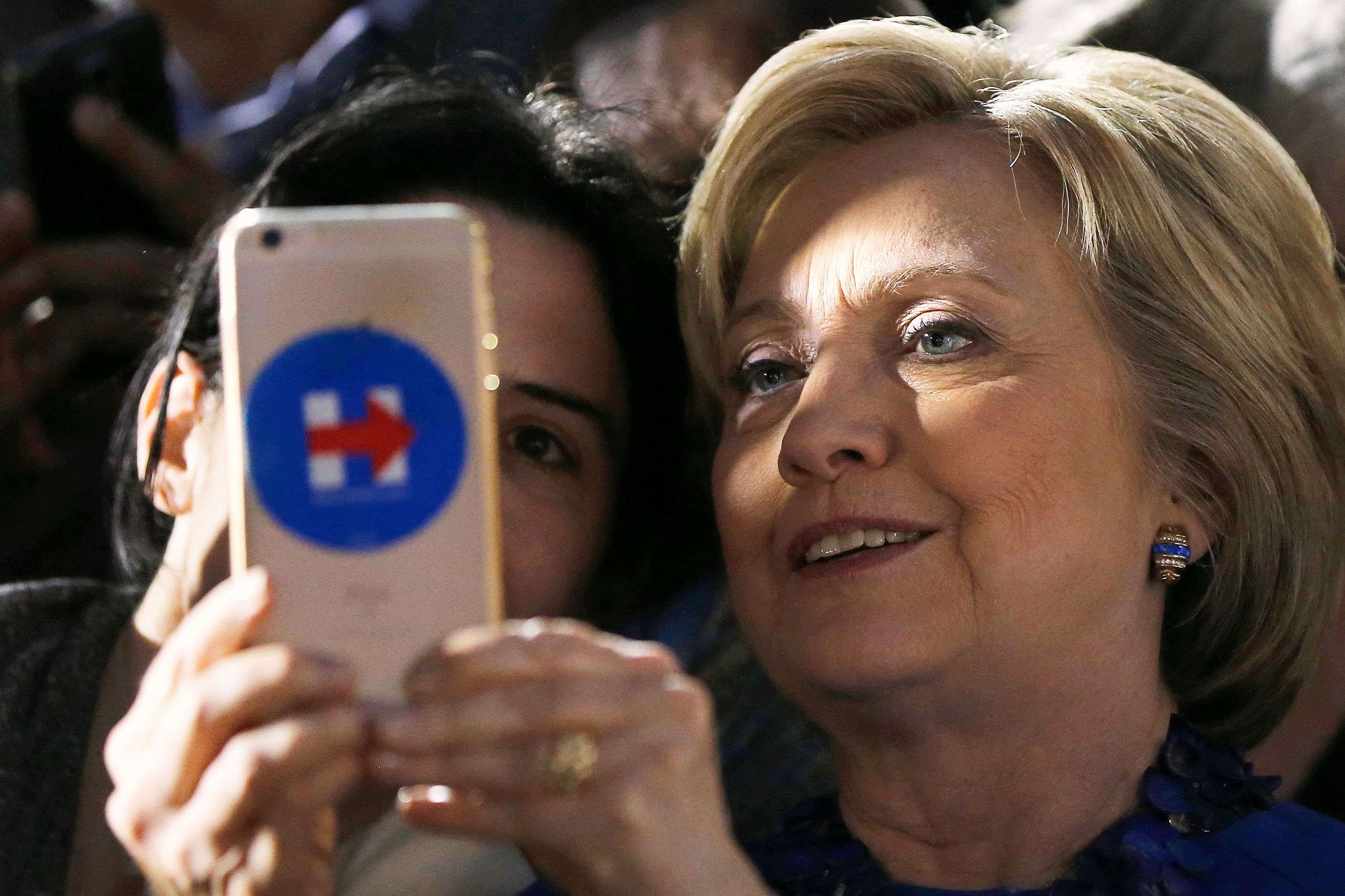 Democratic presidential candidate Hillary Clinton takes a photo with attendees during a campaign stop, Monday, April 25, 2016, at City Hall in Philadelphia. (AP Photo/Matt Rourke)