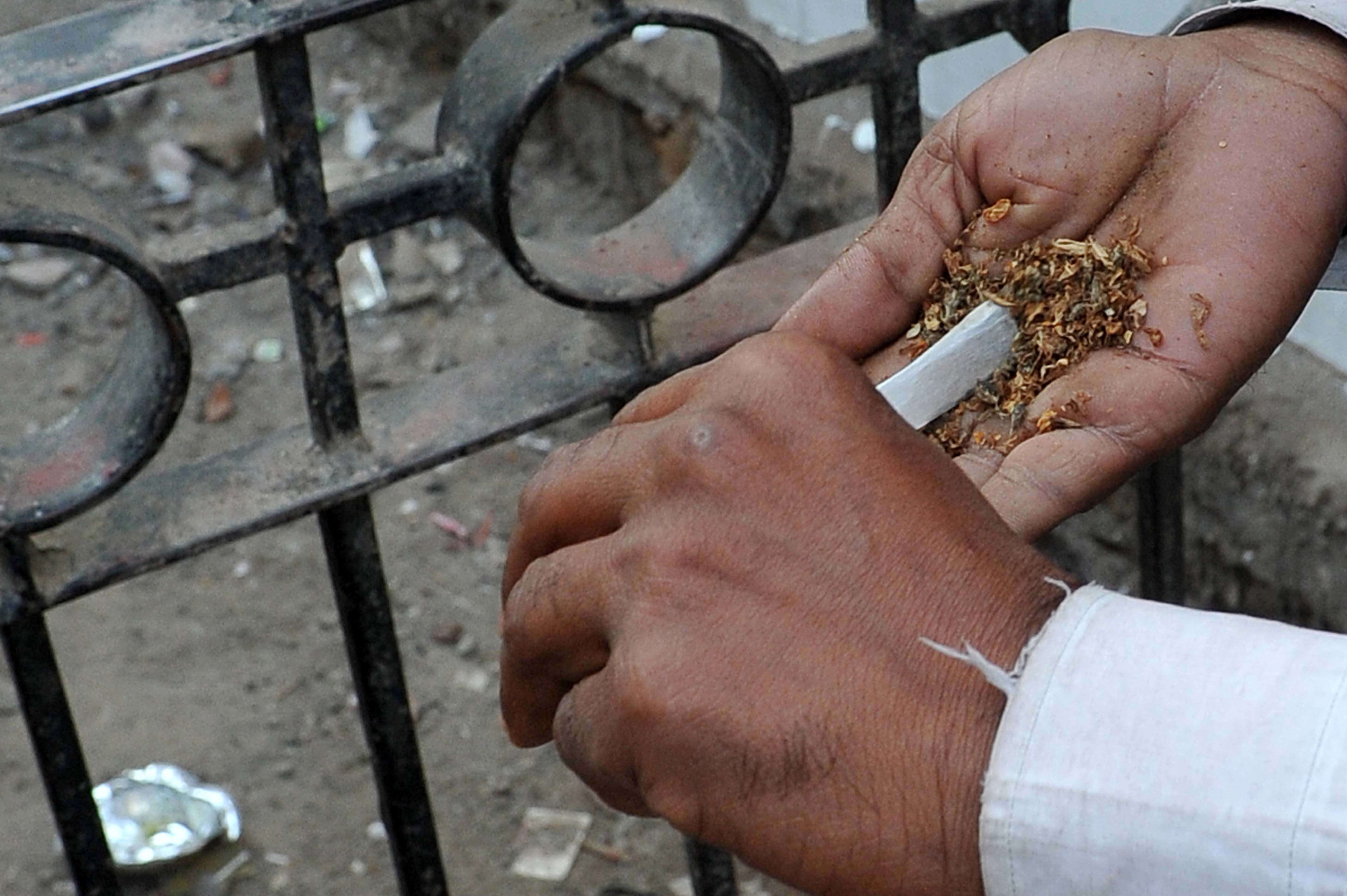 Openly smoking grass (Ganja) taking just behind the Andrews Ganj Police Station in Delhi as crime rate of Delhi is increasing a lot .--------------------------PIC BY ANINDYA CHATTOPADHYAY