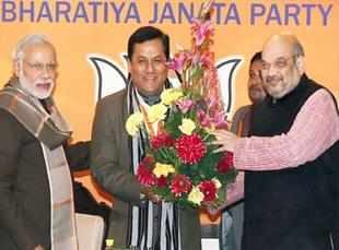BJP's chief ministerial candidate, Sarbanand Sonowal with Narendra Modi and Amit Shah