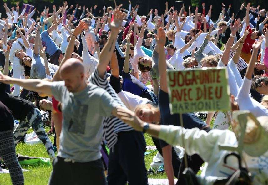 People take part in a yoga session in Brussels. (Photo courtesy: AFP)