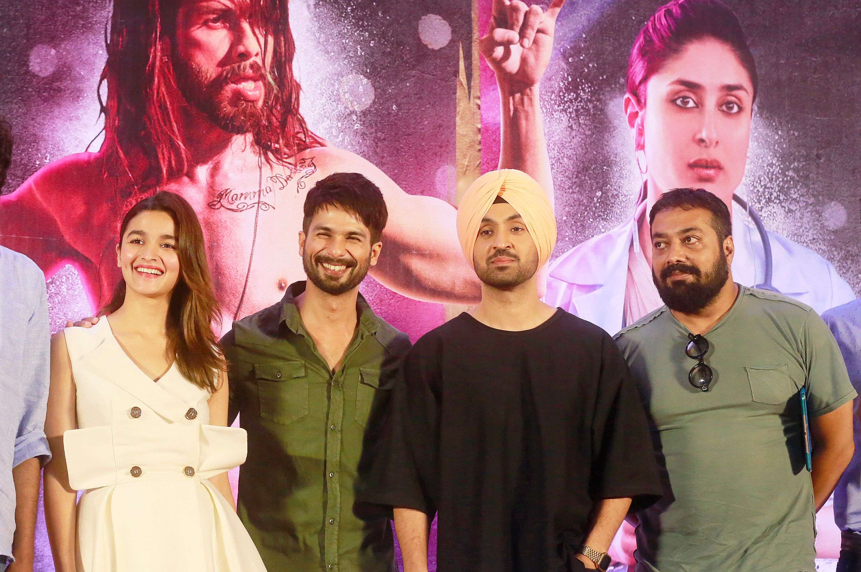 Bollywood film "Udta Punjab," or "Flying Punjab" actors from left, Alia Bhatt,  Shahid Kapoor and Diljit Dosanjh along with film producer Anurag Kashyap pose for photographs after a press conference of the film in Mumbai, India, Tuesday, June 14, 2016. The Bollywood movie about drug abuse in India's northern state of Punjab can be released in theaters across the country with one potentially offensive scene removed, rather than the many cuts sought by censors, a court ruled Monday. The director and producers of the film had appealed to the court last week after the Censor Board sought removal of nearly 90 scenes before it would declare the film fit for screening.(AP Photo/Rafiq Maqbool)