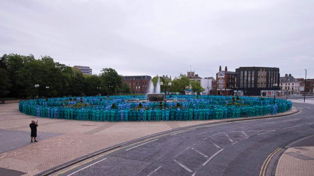 Paint it blue Thousands strip and paint themselves blue in UK for art