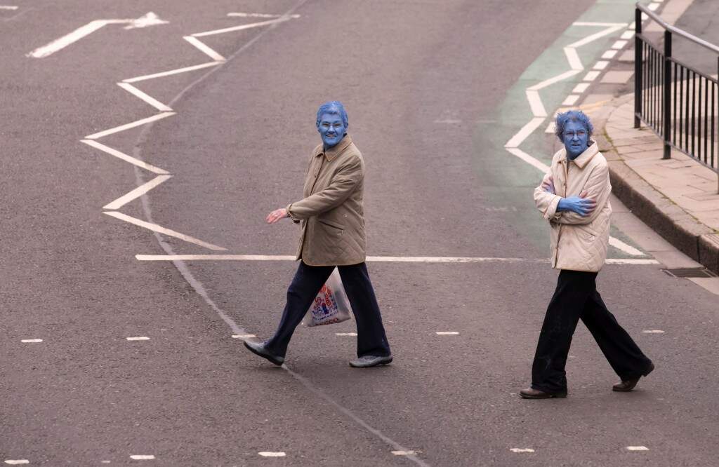 Paint it blue Thousands strip and paint themselves blue in UK for art