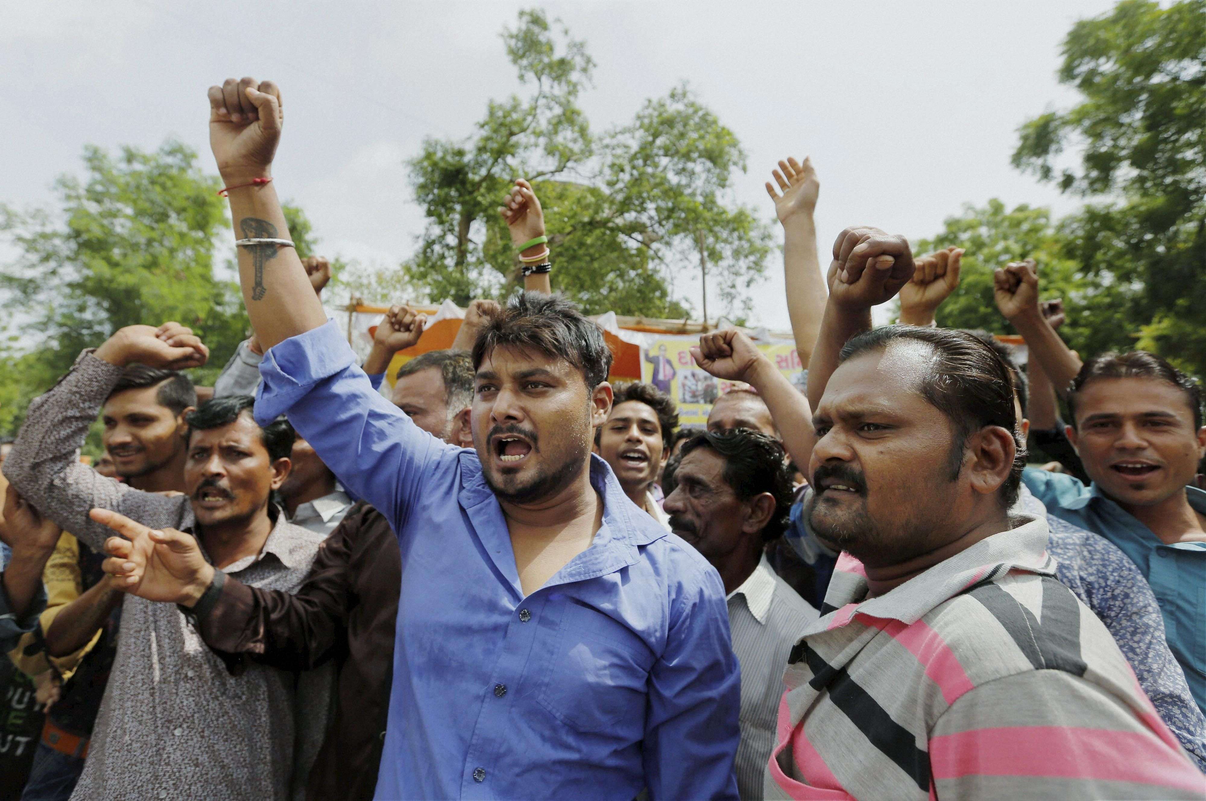 Ahmedabad: Dalit community members shout slogans during a protest in Ahmedabad on Friday against the recent attack on dalit members at Una, Rajkot. PTI Photo (PTI7_22_2016_000130A)