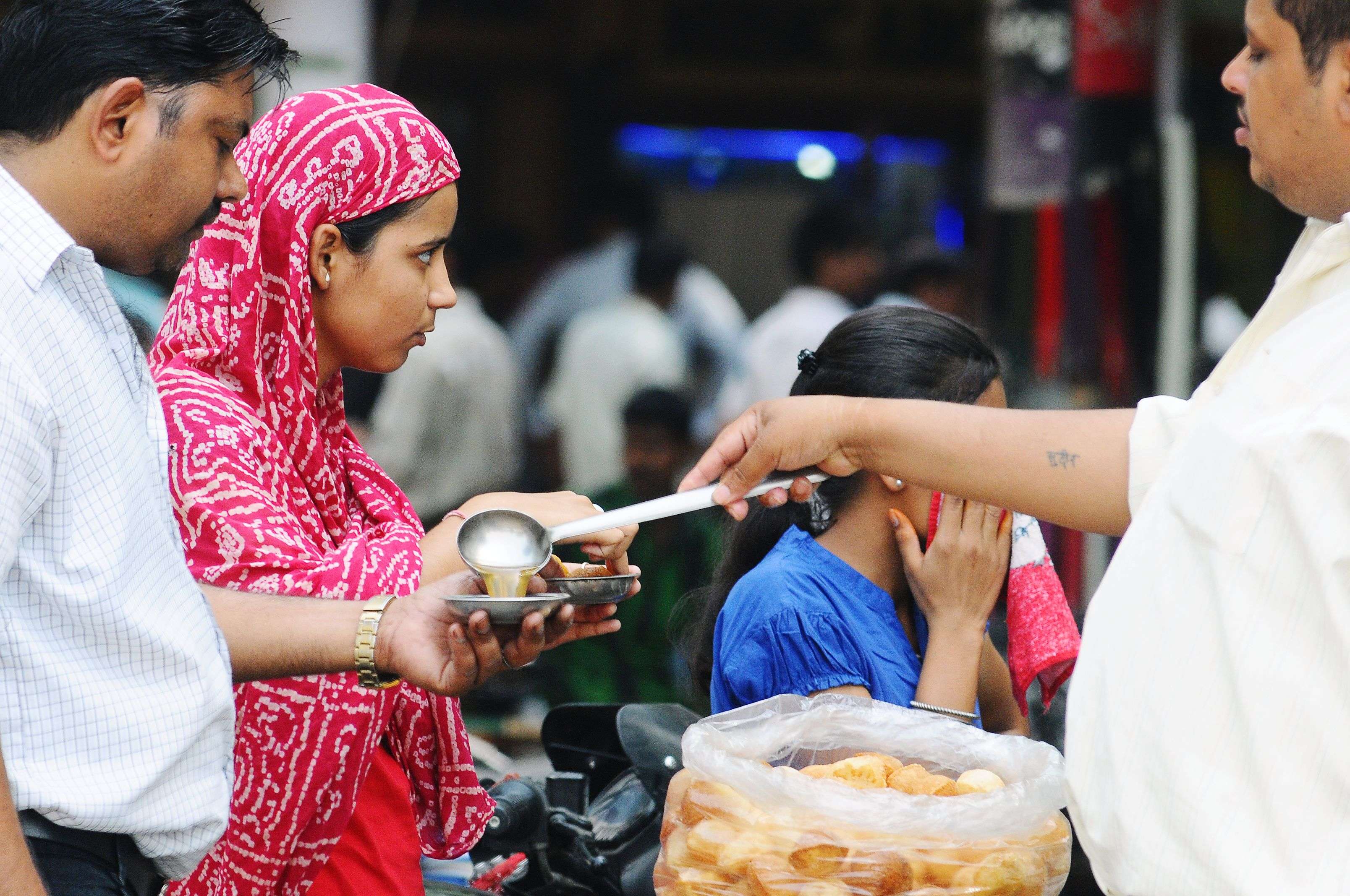 People eating golgappa (also known as pani-puri) in sec 22 at Chandigarh There is no check on sale of cut fruits due to poor enforcement by MC. Doctors warn against consumption of drinks served in unhygienic conditions as these could lead to health problems. photo: BALISH AHUJA