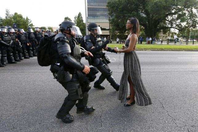 Protestor Ieshia Evans is detained by law enforcement near the headquarters of the Baton Rouge Police Department in Baton Rouge, Louisiana, U.S. July 9, 2016.  REUTERS/Jonathan Bachman