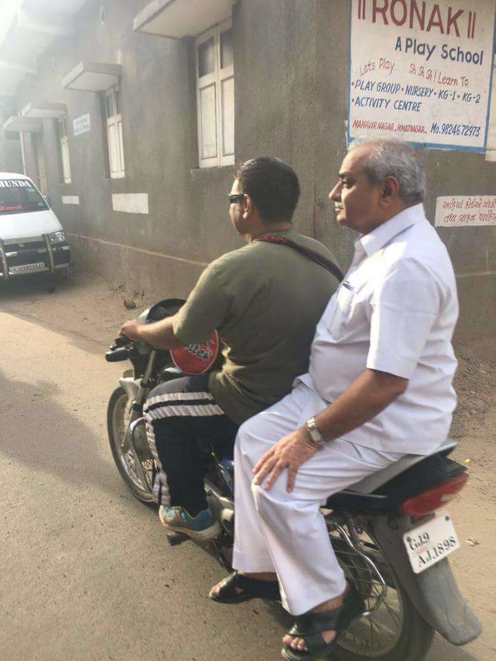 Gujarat Deputy Chief Minister Nitin Patel on a motorbike