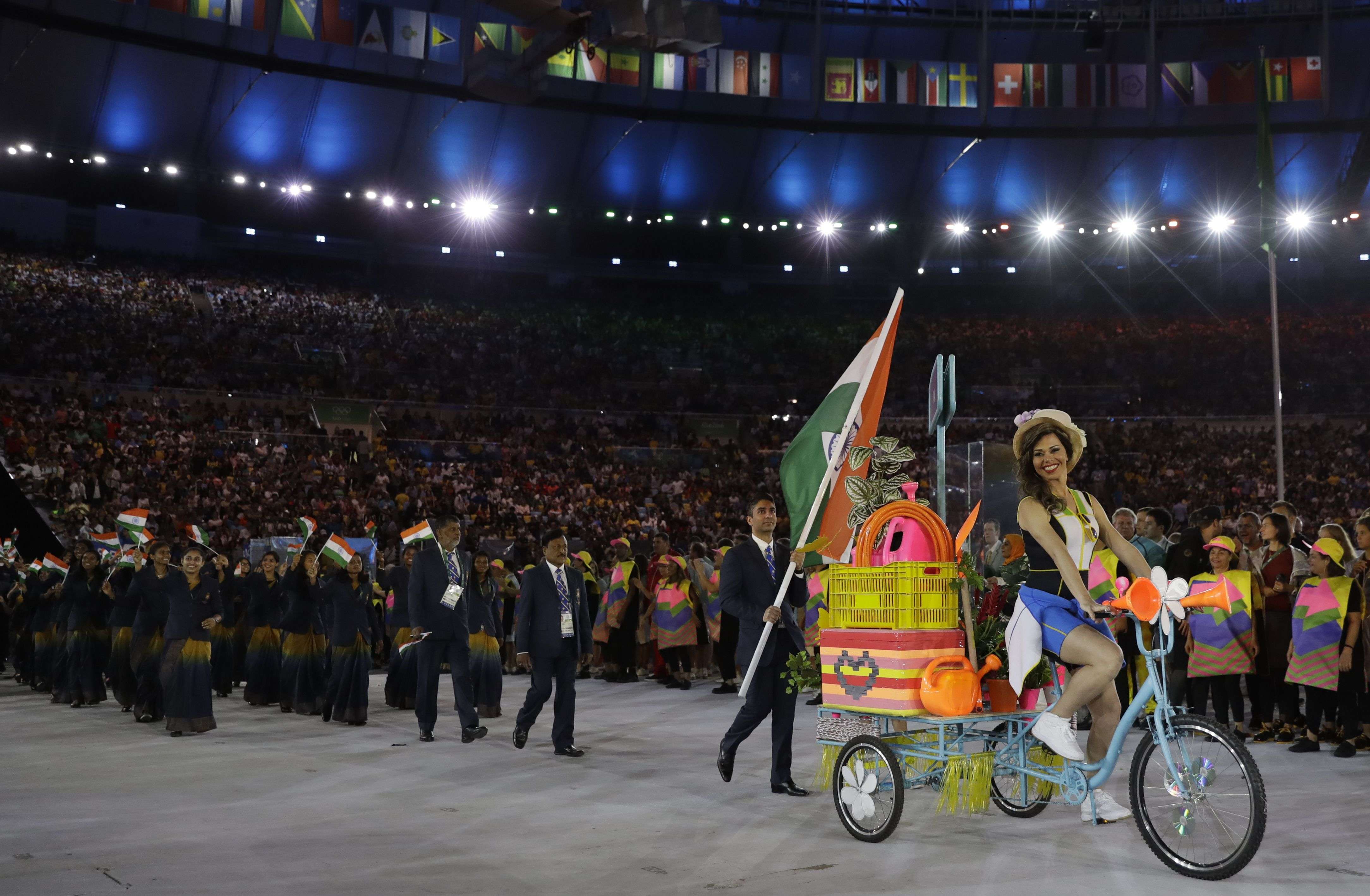 Abhinav Bindra carries the flag of India during the opening ceremony for the 2016 Summer Olympics in Rio de Janeiro, Brazil, Friday, Aug. 5, 2016. (AP Photo/David J. Phillip)