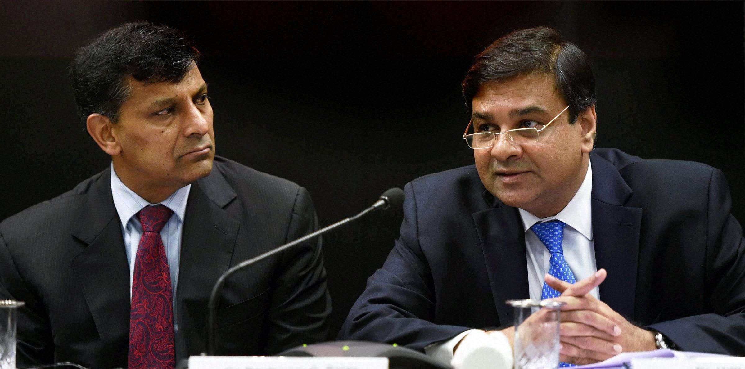 Mumbai: RBI Governor Raghuram Rajan looks on as deputy governor  Urjit Patel speaks at a press conference after the monetary policy review meeting at the RBI headquarters in Mumbai on Tuesday. PTI Photo by Shashank Parade (PTI8_9_2016_000085A)