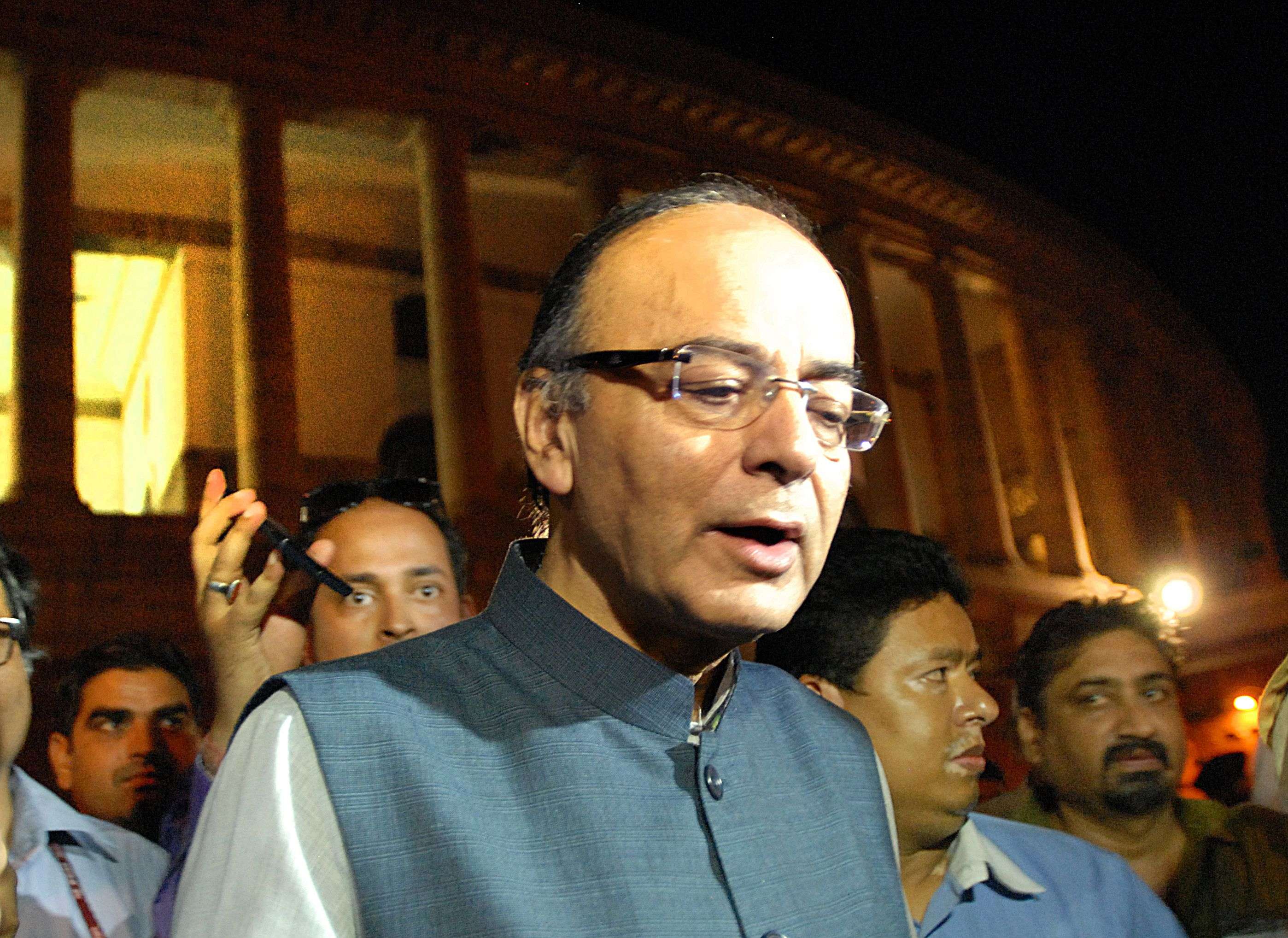 Finance Minister Arun Jaitley comes out from Rajya Sabha after the voting on the GST Bill in New Delhi on Wednesday. --- Piyal Bhattacharjee