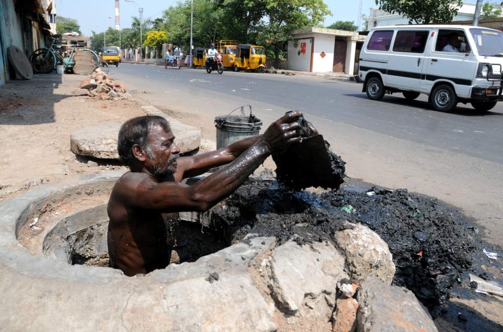 Inspite of the high court banning manual scavenging, the contract labourers are still deployed to remove the clogged drains. The picture was taken at Raja Muthiah Rd, Periyamet in Chennai.22-20-2009 pic B A Raju