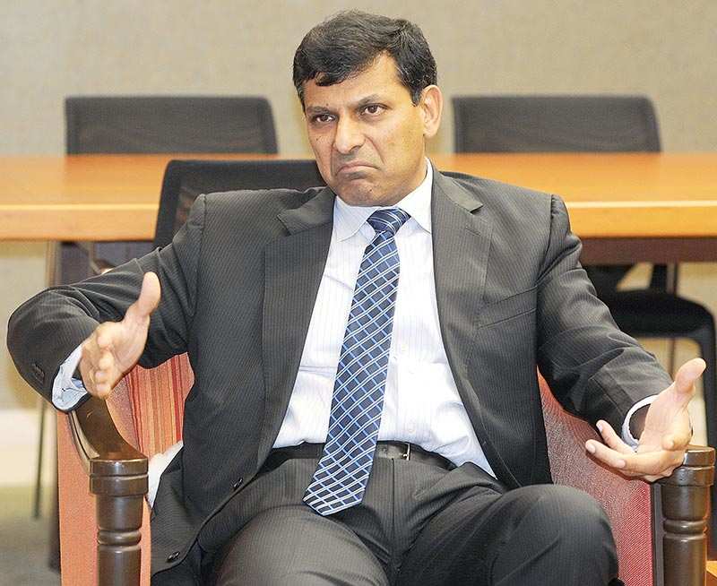 Wait and watch: Former RBI governor Raghuram Rajan was for letting the market decide the exchange rate.