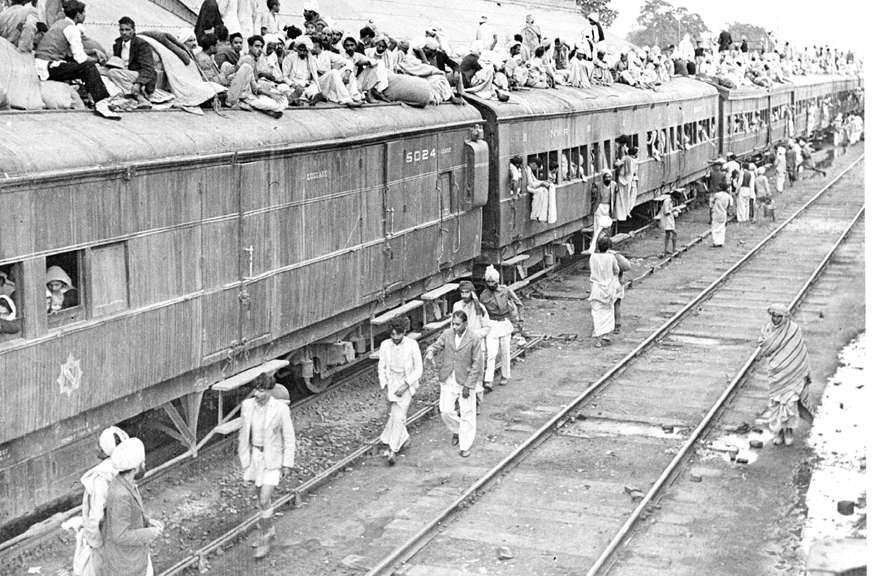 APO/February,54,A31d A refugee special train at Ambala Station. The carriages are full and the refugees seek room on top.