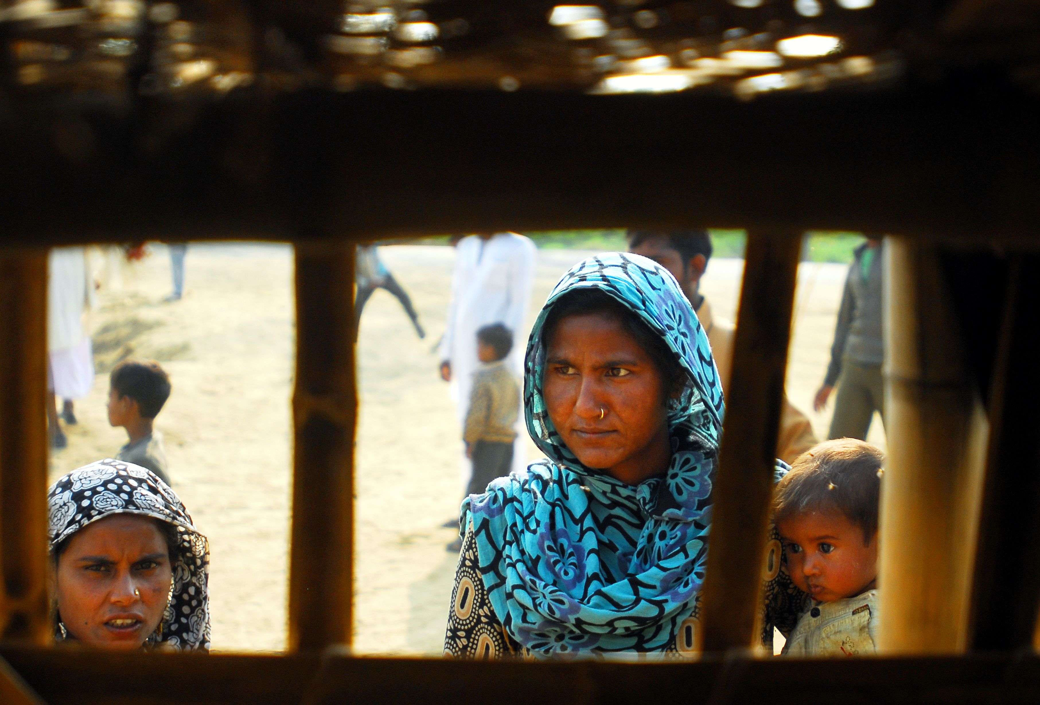 Ladies wait for relief material in Malakpur camp near Muzaffarnagar. --- Piyal bhattacharjee