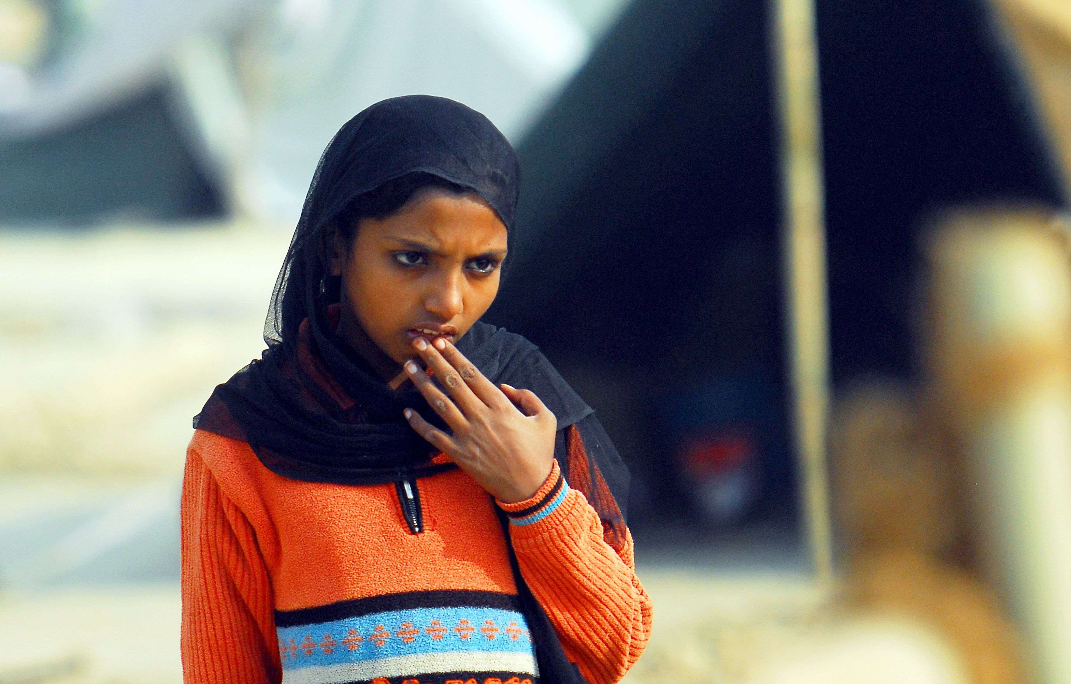 A girl waits for relief material in Malakpur camp near Muzaffarnagar. --- Piyal bhattacharjee
