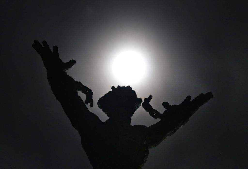 The supermoon shines over the 'West Irian Liberation Monument' in Jakarta, Indonesia. (AP Photo/Dita Alangkara)