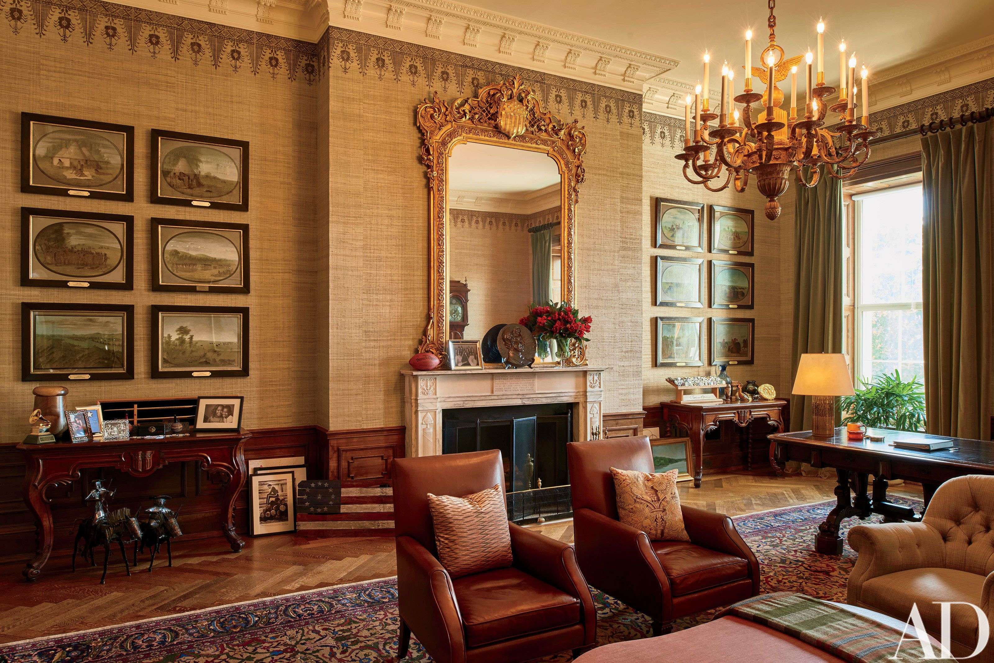 This image provided by Architectural Digest shows The Treaty Room in the White House in Washington. The Treaty Room is filled with memorabilia including one of President Barack Obama's two Grammy Awards, family photos, and a personalized football. It's also where Obama often retreats late at night. He uses the room's namesake table, which has been in the White House since 1869, as a desk. (Michael Mundy/Architectural Digest via AP)